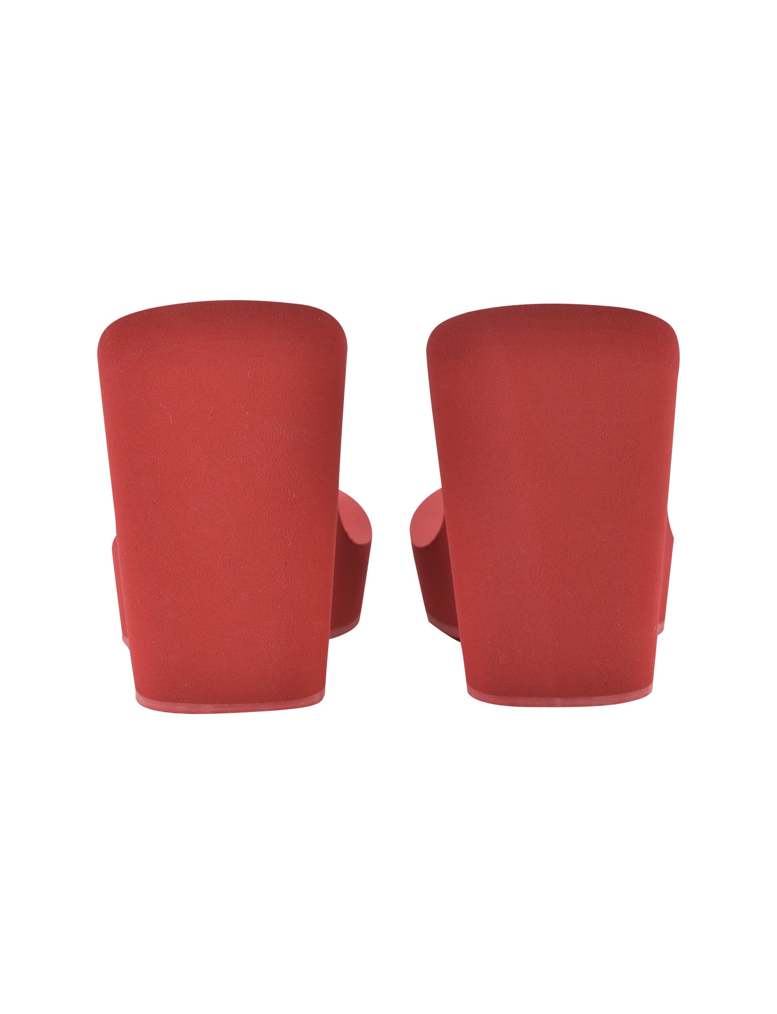 A pair of I.AM.GIA SHELBY FLIP FLOP - RED viewed from the back, showcasing solid red heels and the bottoms against a plain white background.