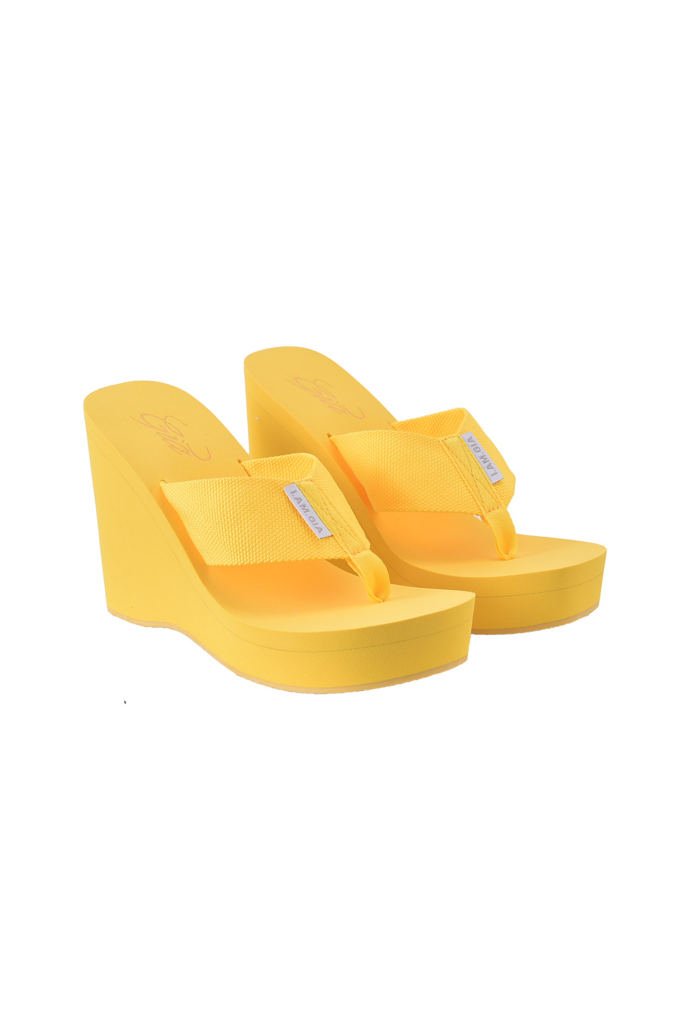 The I.AM.GIA SHELBY FLIP FLOP - YELLOW sandals feature mesh straps and small white tags, shown against a plain background.