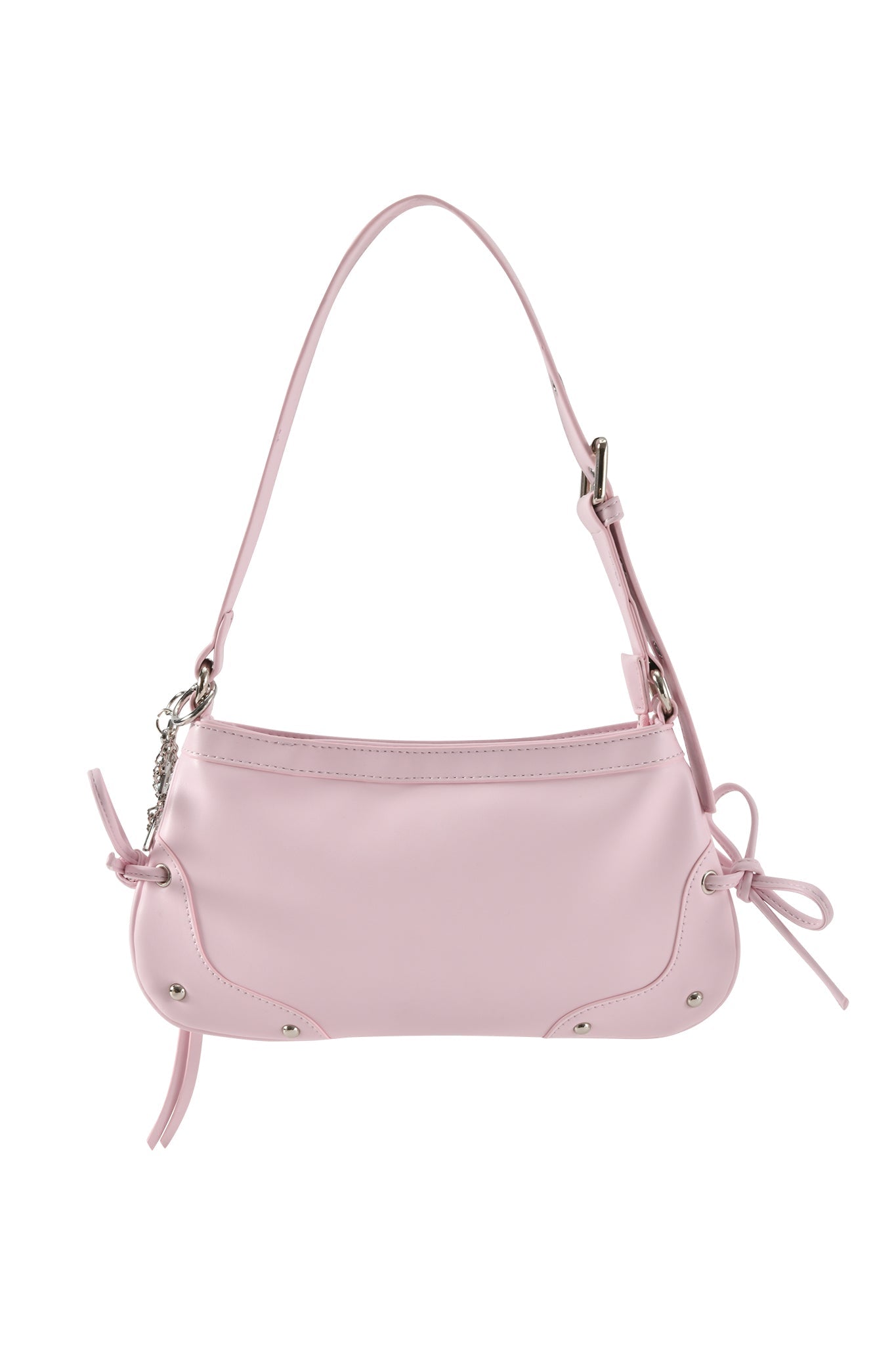 The HAYLEY BAG - BABY PINK by I.AM.GIA features a single adjustable shoulder strap, silver-tone hardware, small side bows, and decorative stitching at the bottom corners.