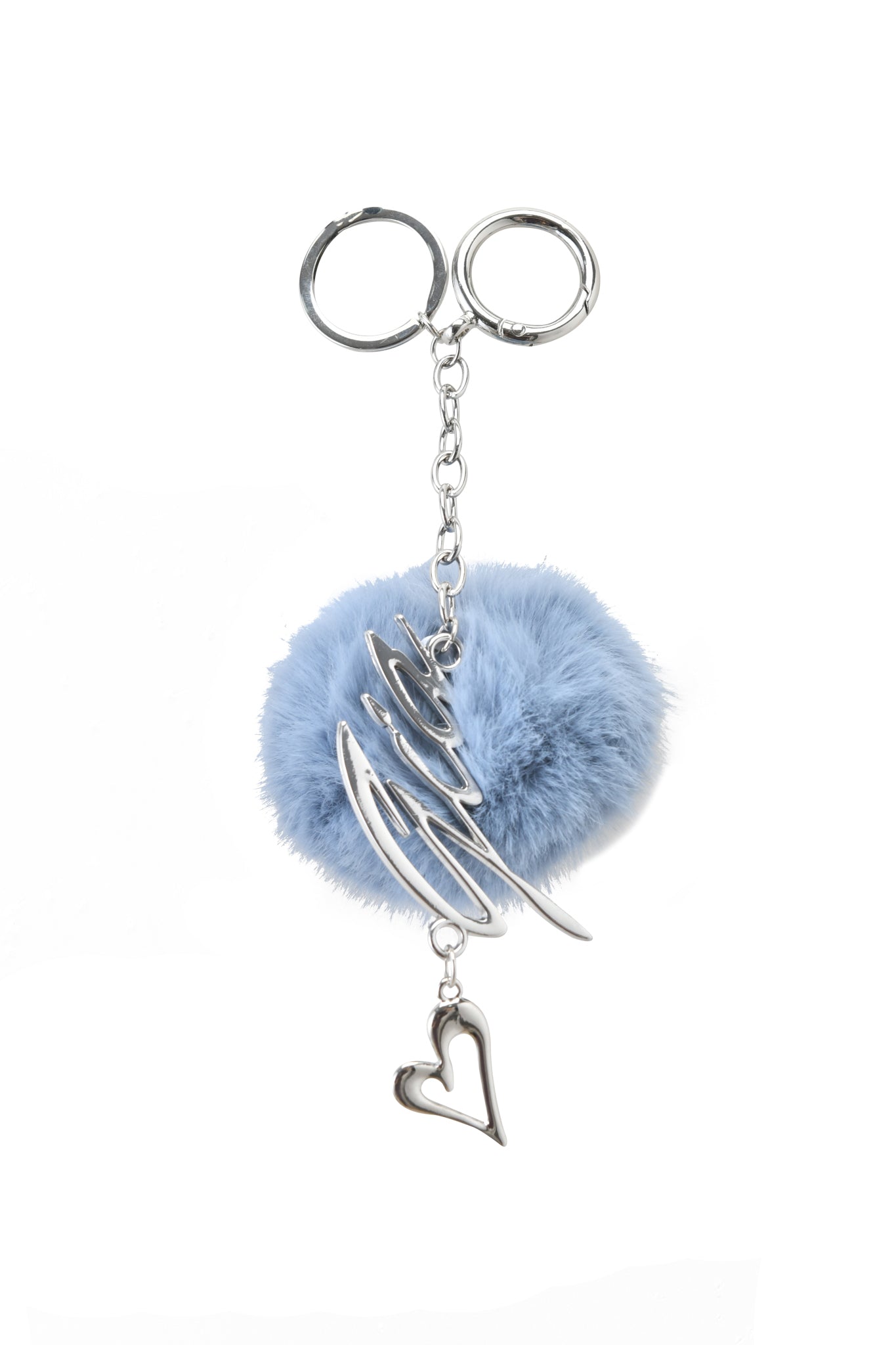 The LARSA KEYCHAIN - BLUE by I.AM.GIA features a fluffy light blue pom-pom, abstract silver wire design, and a dangling silver heart charm on a silver chain, shown against a white background.