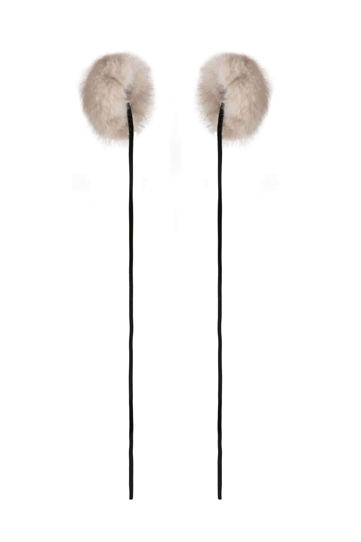 Two fluffy, round FAWN HEADPHONE COVERS in Neutral Taupe by I.AM.GIA, made from soft faux fur, are attached to long black strings and displayed against a plain white background.