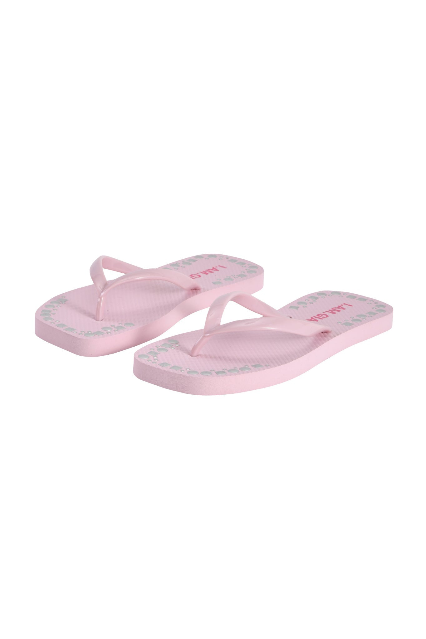 The INKA STUDDED FLIP FLOP in baby pink by I.AM.GIA features thin straps and subtle edge detailing, offering a sweet, casual look for any day.