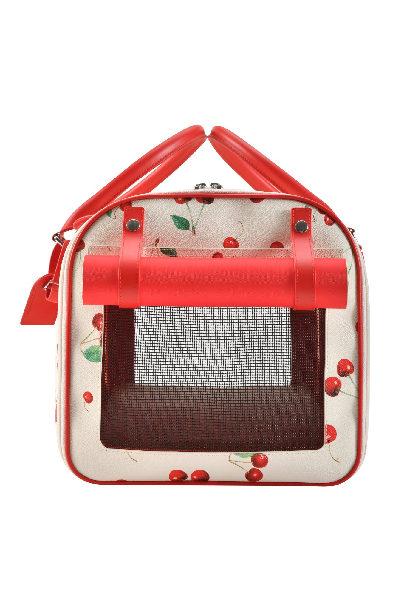 The TRIXX PET CARRIER - CHERRY ON TOP by I.AM.GIA is a small cream-colored pet carrier with cherry print, red handles, a front mesh window, and a red strap above the window.