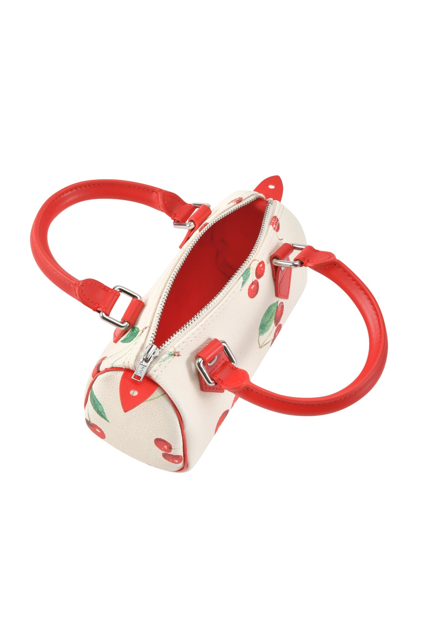 The I.AM.GIA NIKA MINI BAG - CHERRY ON TOP is a small cream barrel purse with red handles, Cherry on Top print, silver zipper, and a removable strap. Pictured from above with the zipper partially open.