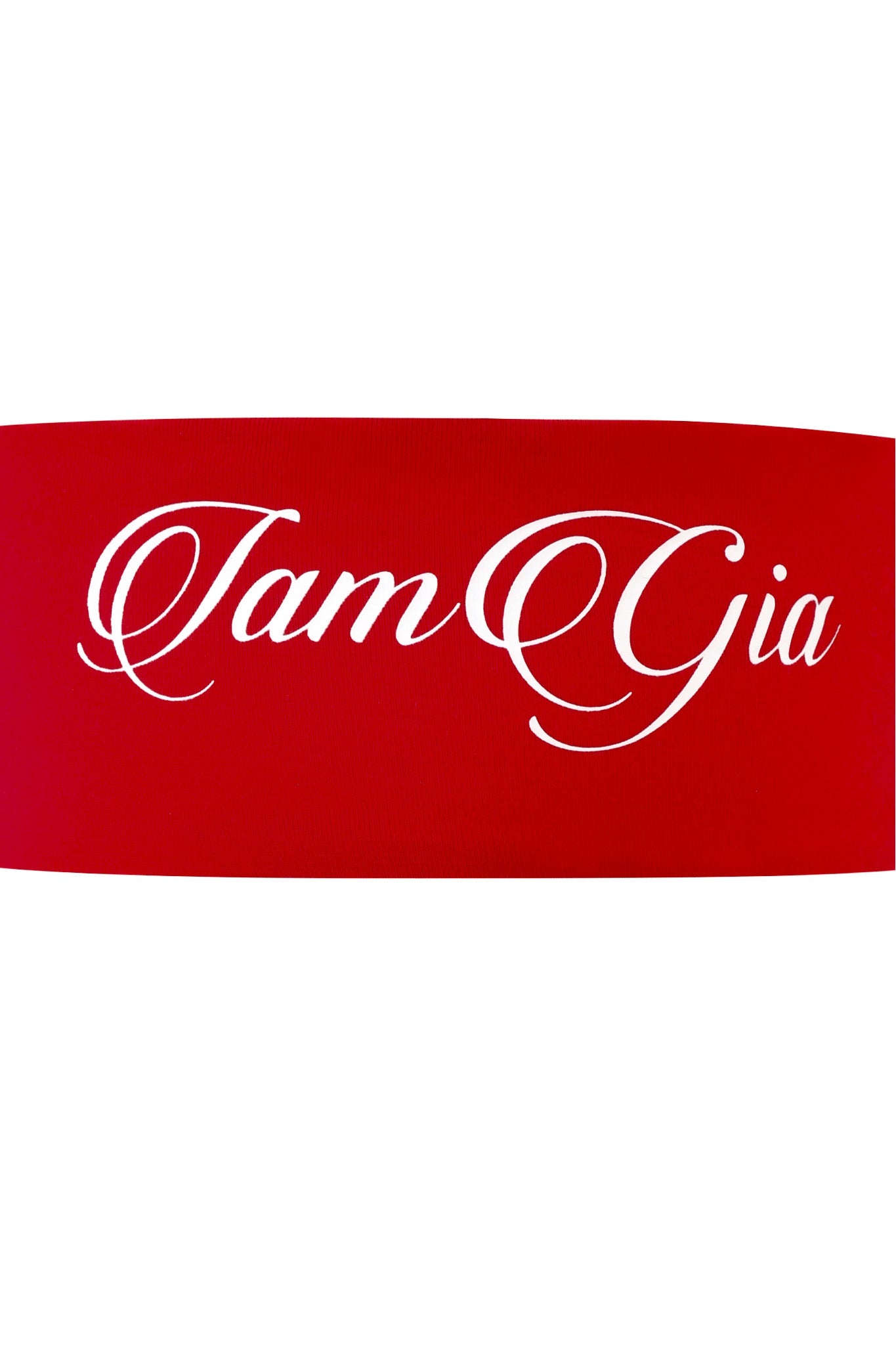 The BLARE SPORT HEADBAND - CRIMSON by I.AM.GIA features a red band with crisp white branding, offering a bold, sporty accent to your look.