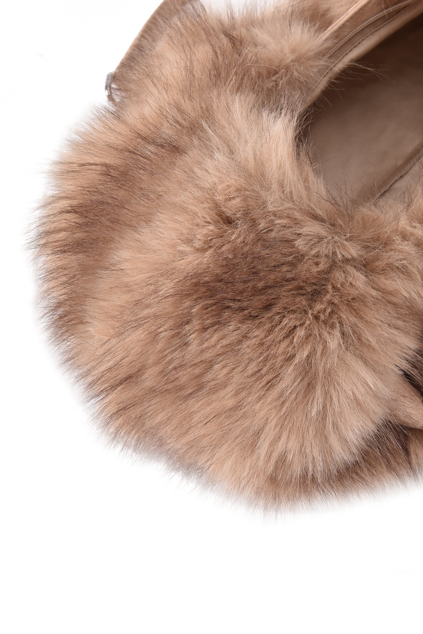 Close-up of the I.AM.GIA GENA FAUX FUR HANDBAG - TAN SUEDE, showcasing its soft, fluffy light brown faux fur radiating outward in various directions against a white background. The luxurious shoulder bag features silver chain straps and a chic faux suede finish, adding elegance and distinction to this stylish accessory.