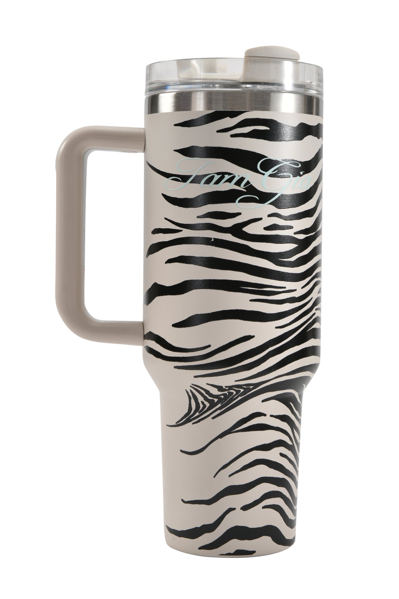 Introducing the I.AM.GIA BLARE CUP - FINE LINE ZEBRA: a 40oz tall insulated stainless steel tumbler with a generous handle, showcasing an eye-catching fine line zebra stripe design over a beige background. Complete with a clear lid, this stylish yet practical travel cup is your ideal companion for on-the-go sipping.