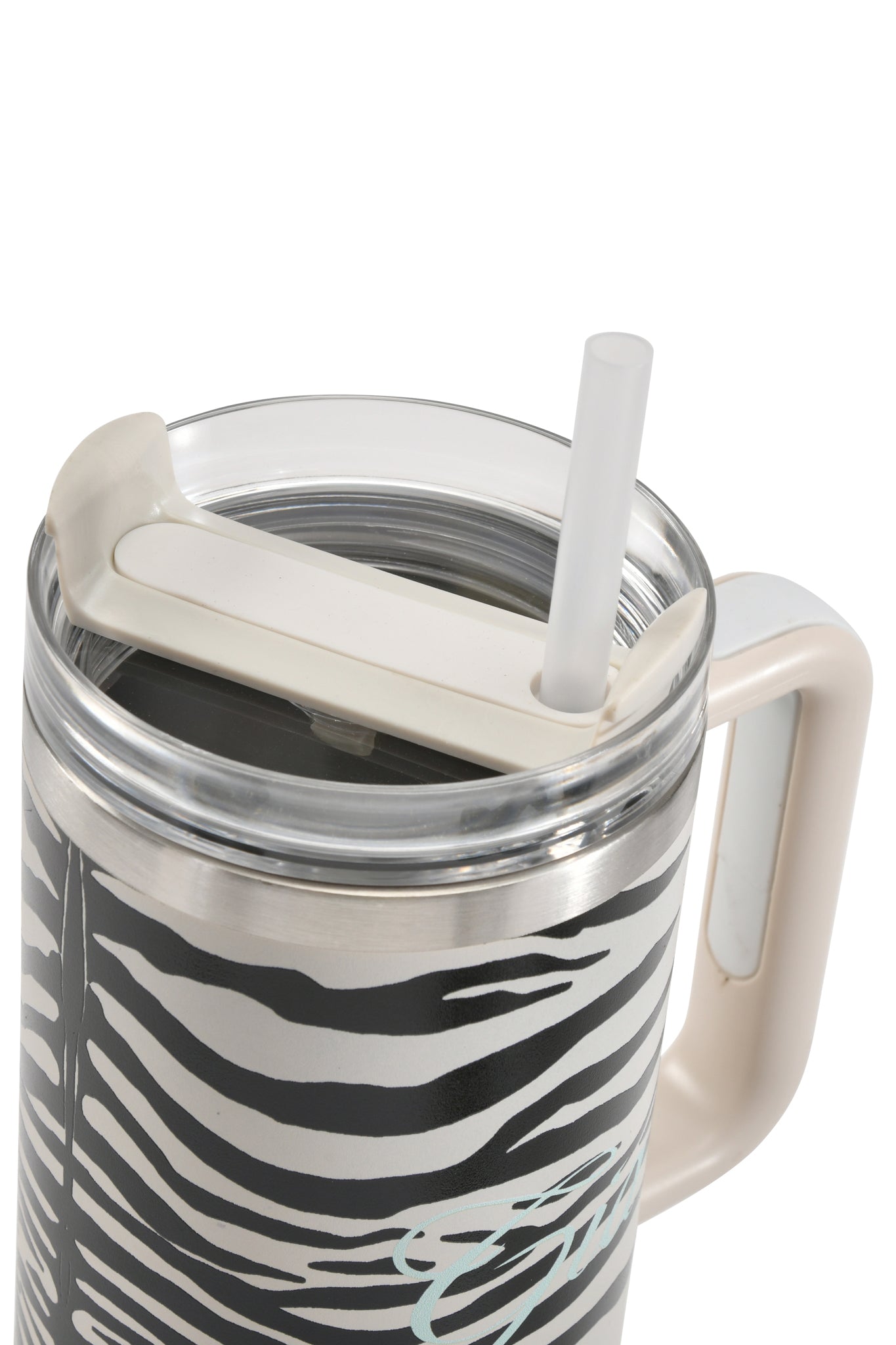 A close-up of the I.AM.GIA BLARE CUP - FINE LINE ZEBRA, showcasing its zebra-striped design with a white lid, a white handle, and a clear straw inserted through the lid. This 40oz insulated stainless steel tumbler is crafted to keep your drinks at the perfect temperature.