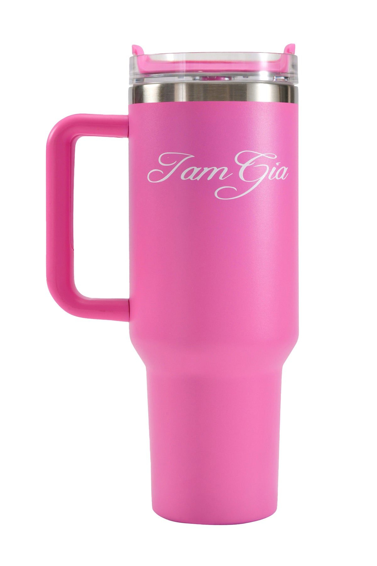 Introducing the BLARE CUP - PINK by I.AM.GIA: This tall, hot pink travel mug features a sturdy handle and a clear lid, with “TamGia” elegantly written in white script on its side. Crafted from insulated stainless steel, this tumbler keeps your drinks at the ideal temperature wherever you go.