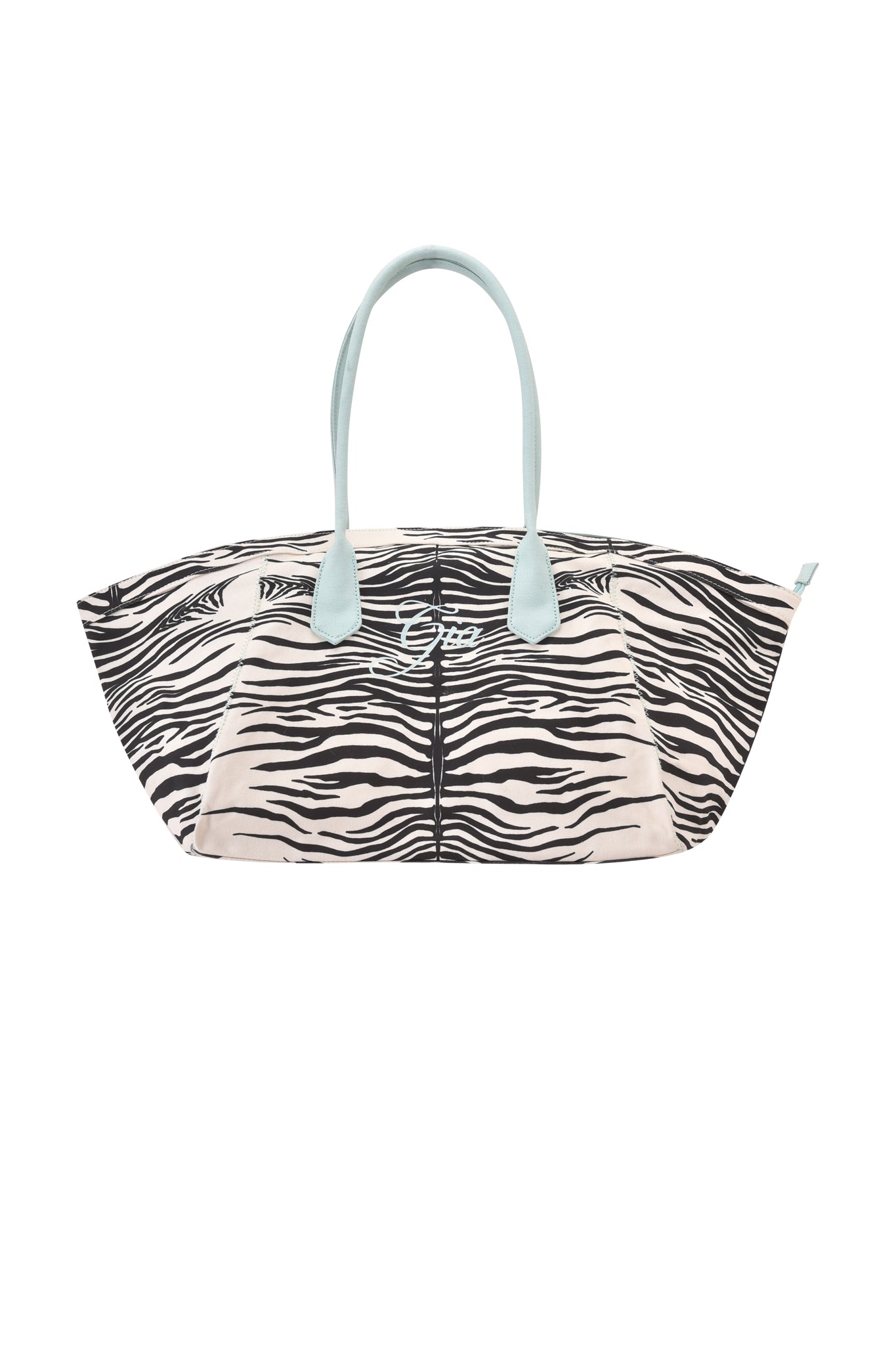 Introducing the BLARE TOTE BAG - FINE LINE ZEBRA by I.AM.GIA: a chic oversized shopper bag made from heavyweight cotton canvas, featuring a bold fine line zebra print in black and white, light blue handles, and a subtle embroidered logo at the front center.