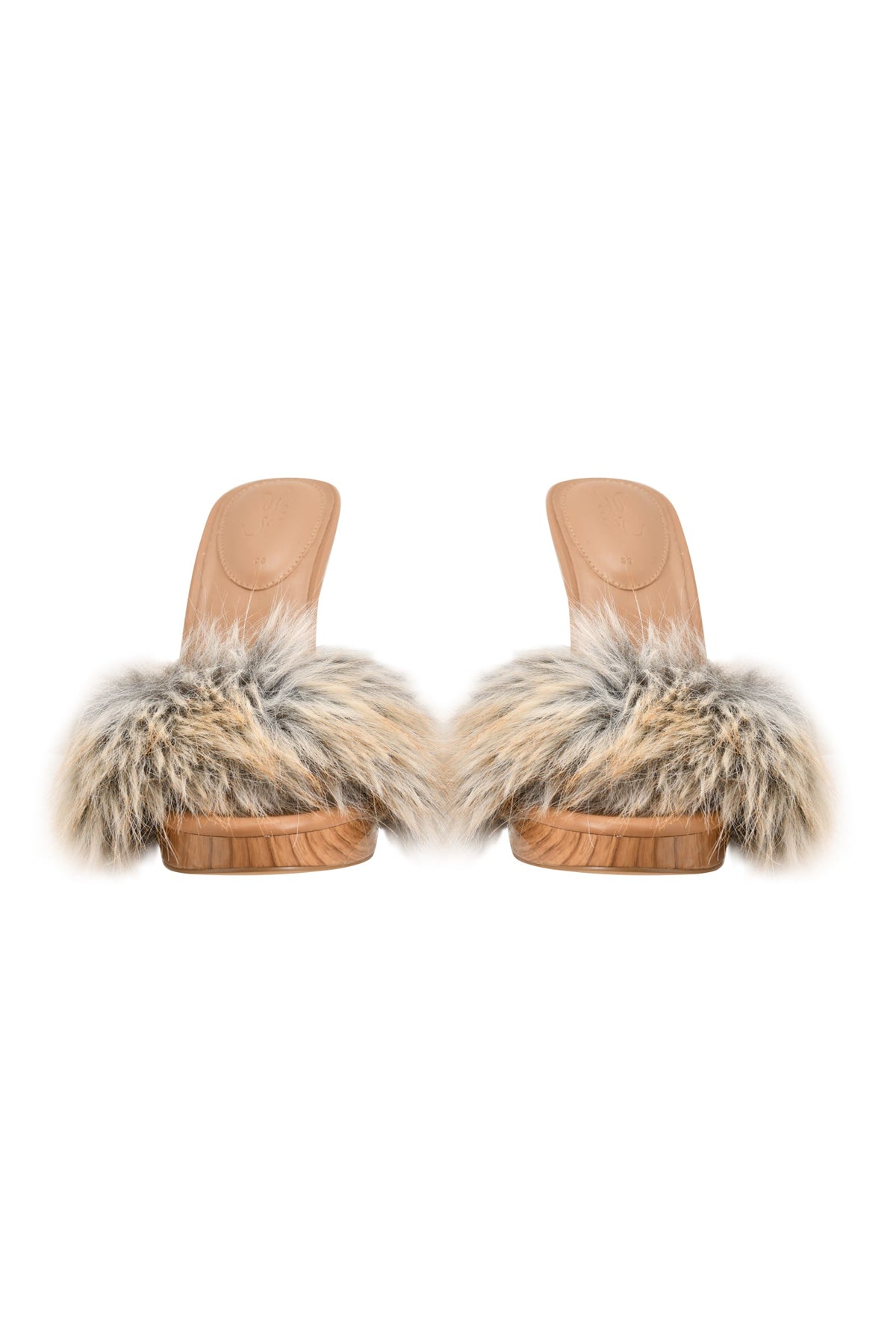Introducing the NICKY HEEL - FAUX FUR TAN by I.AM.GIA: a pair of tan wooden sandals styled as slip-on mules, featuring plush beige and gray faux fur straps and fluffy accents, photographed against a white background.