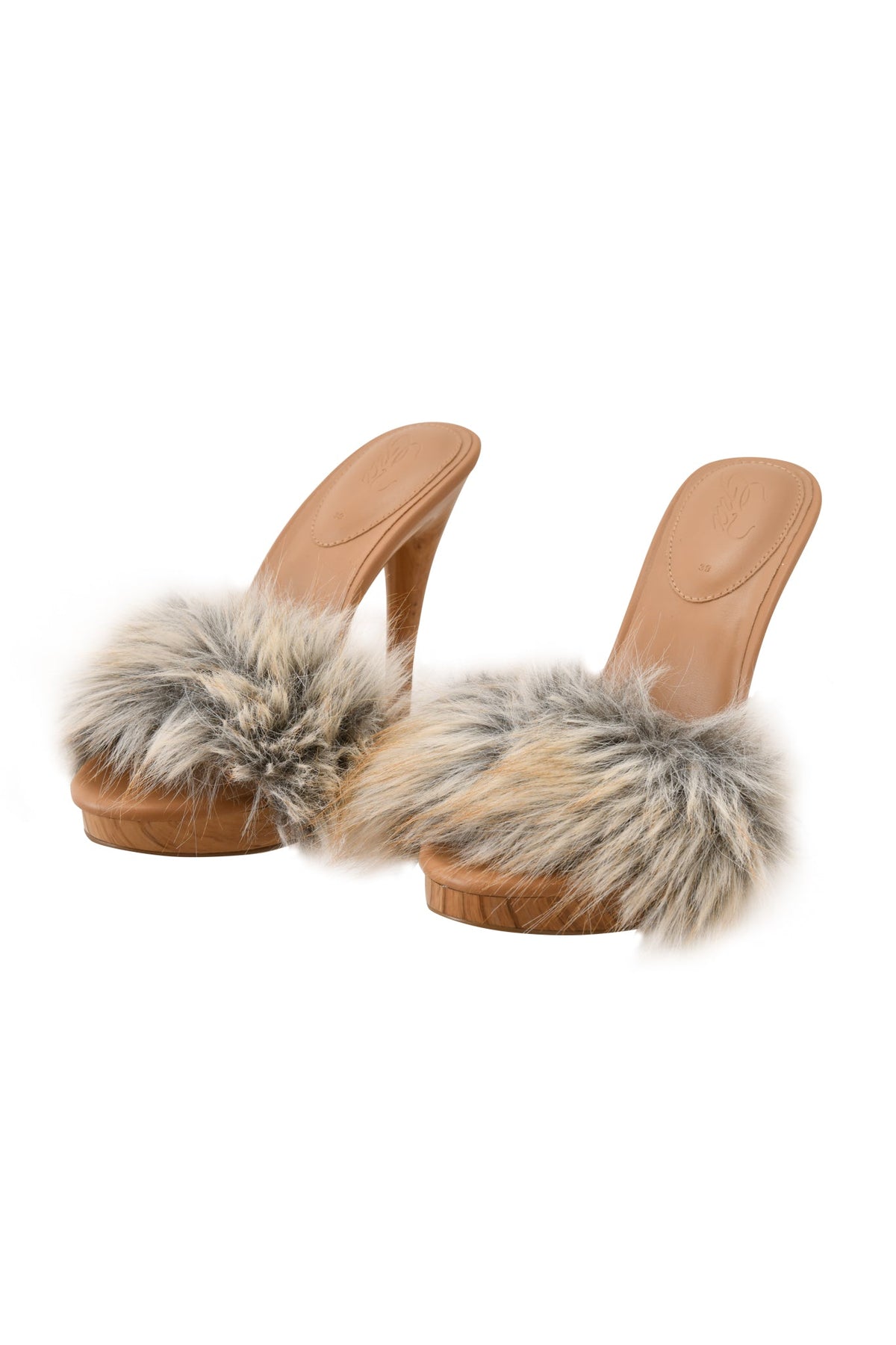 Step into elegance with the NICKY HEEL - FAUX FUR TAN by I.AM.GIA: these chic high-heeled mule sandals feature tan leather soles and wide, fluffy faux fur straps in shades of beige, gray, and black, perfectly finished atop a stylish Nicky heel.