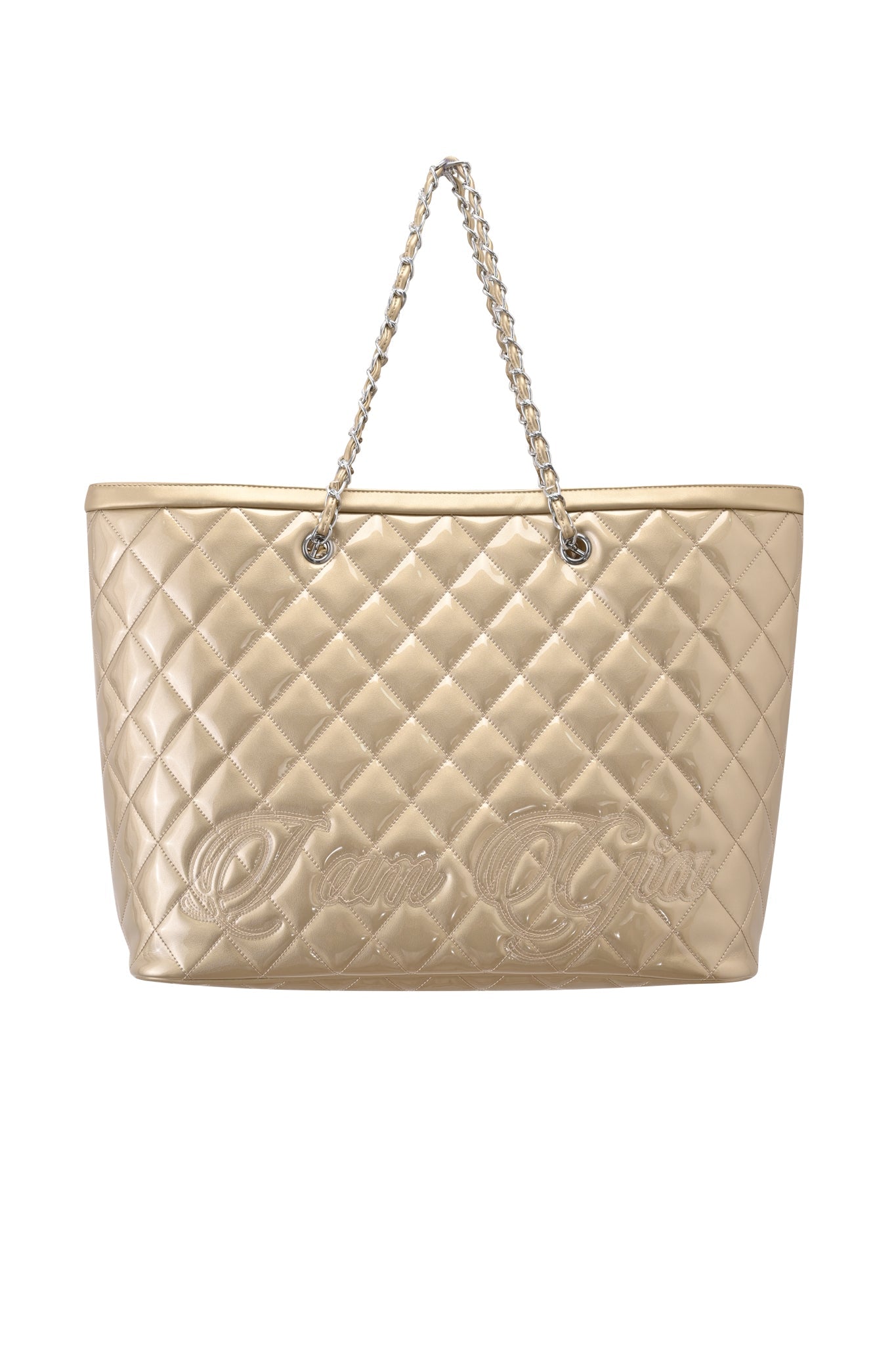 The I.AM.GIA DANNI TOTE BAG in gold showcases a metallic quilted design, chic chain link straps, and embossed cursive script on the front, photographed against a white background.