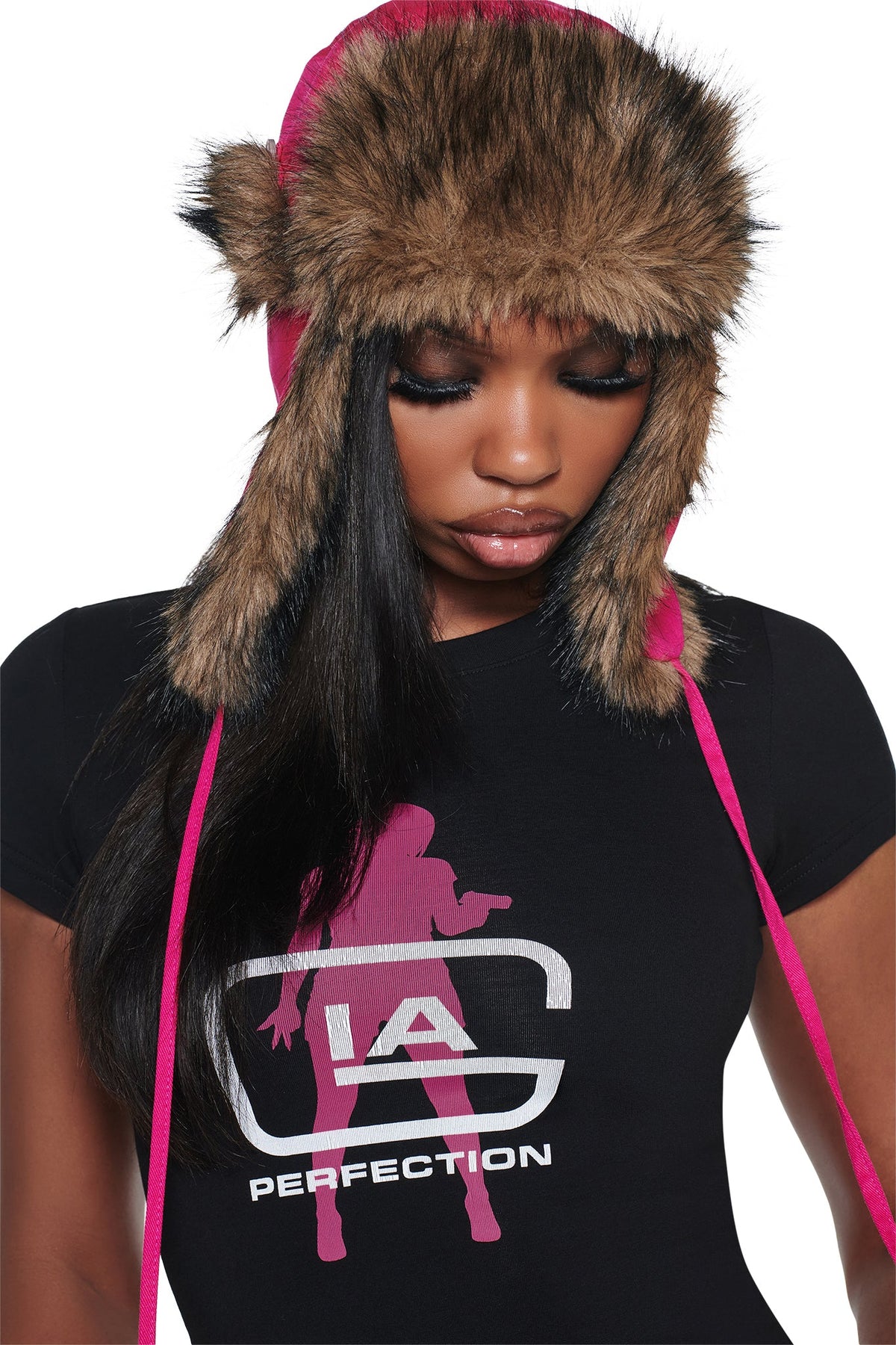 A person wearing a hot pink I.AM.GIA YVL FUR TRAPPER HAT - PINK faux fur trapper hat.