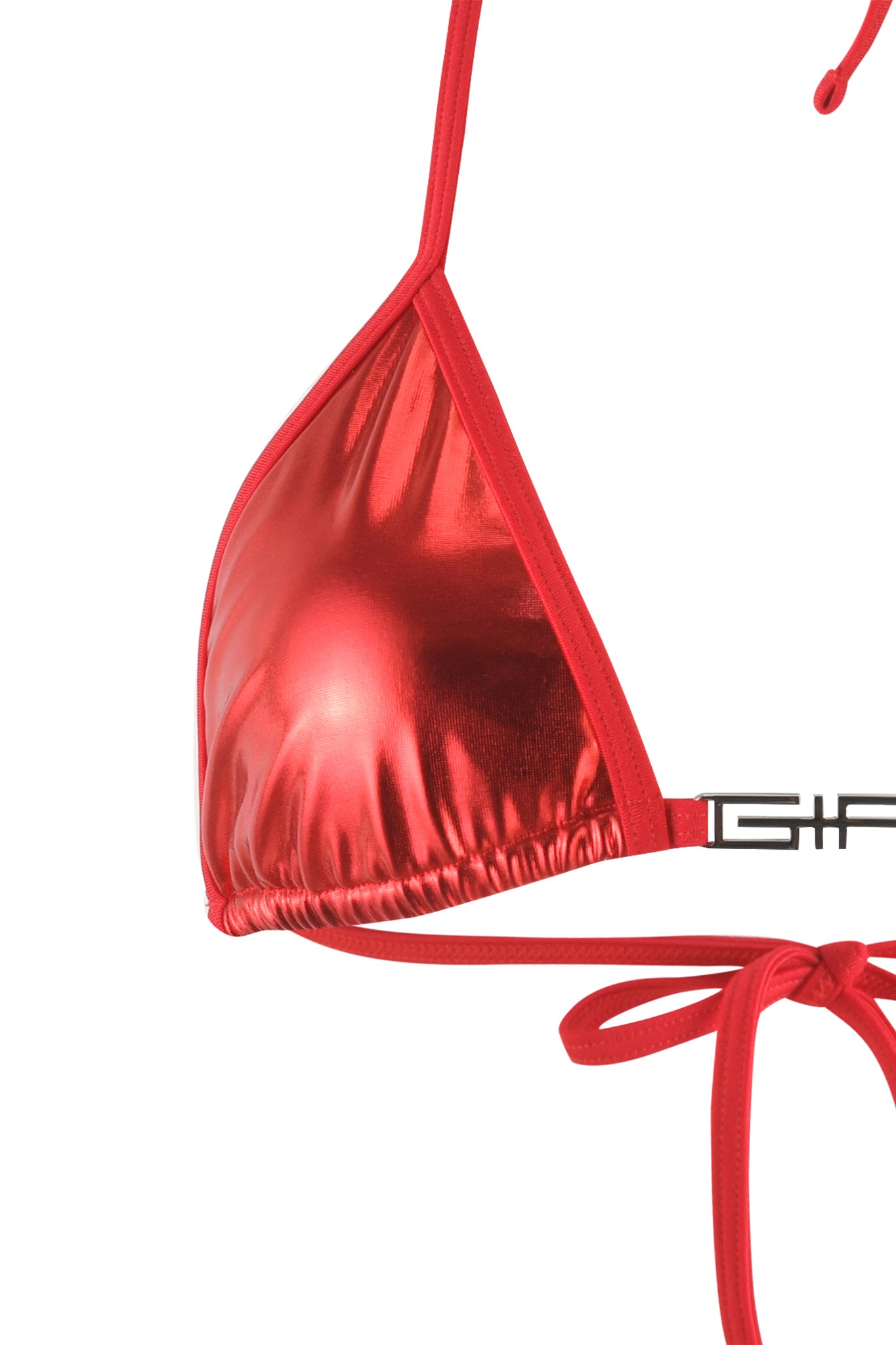 The image shows a close-up of the ALOHI BIKINI TOP - RED by I.AM.GIA. This stunning bikini top features a triangular cup with ruched detailing at the bottom and ties at the neck and back. Part of the thin black strap with "I.AM.GIA" printed on it is visible on the right side.