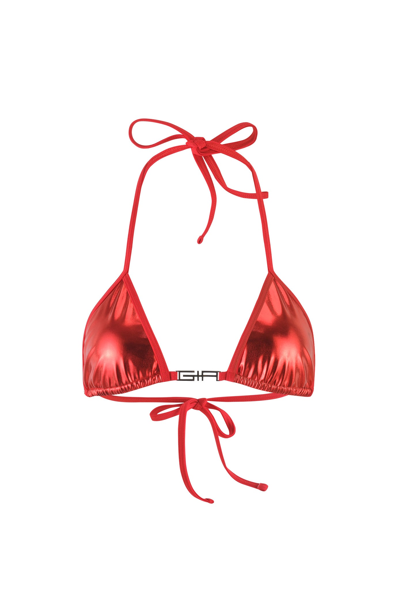 The ALOHI BIKINI TOP - RED by I.AM.GIA is a shiny, metallic red bikini top featuring triangle cups and string ties. It has an adjustable halter neck tie and a back tie, with a small silver clasp in the middle of the chest area.