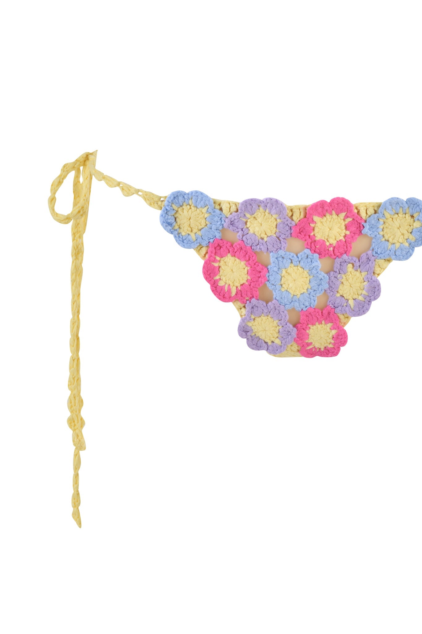 The BLOSSOM BIKINI BOTTOM - MULTI by I.AM.GIA boasts a crochet design with vibrant pink, yellow, and purple flowers. It features adjustable yellow side ties for a perfect fit, highlighting colorful floral patterns for a playful look.