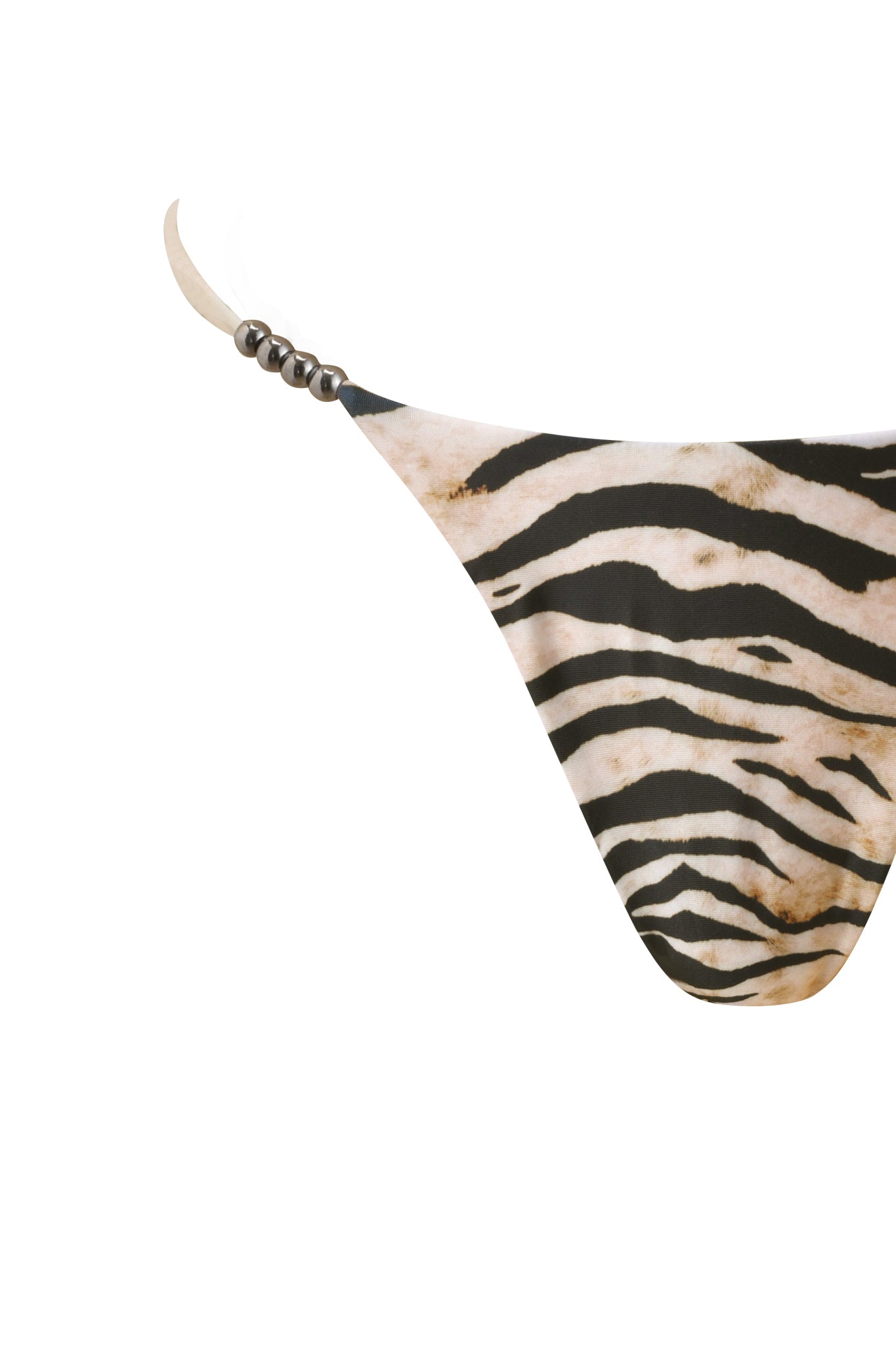 The LUMANI BIKINI BOTTOM - WILD SIDE by I.AM.GIA features a Brazilian cut, black and beige zebra print, string sides with metallic beads, shown close-up against a white background.