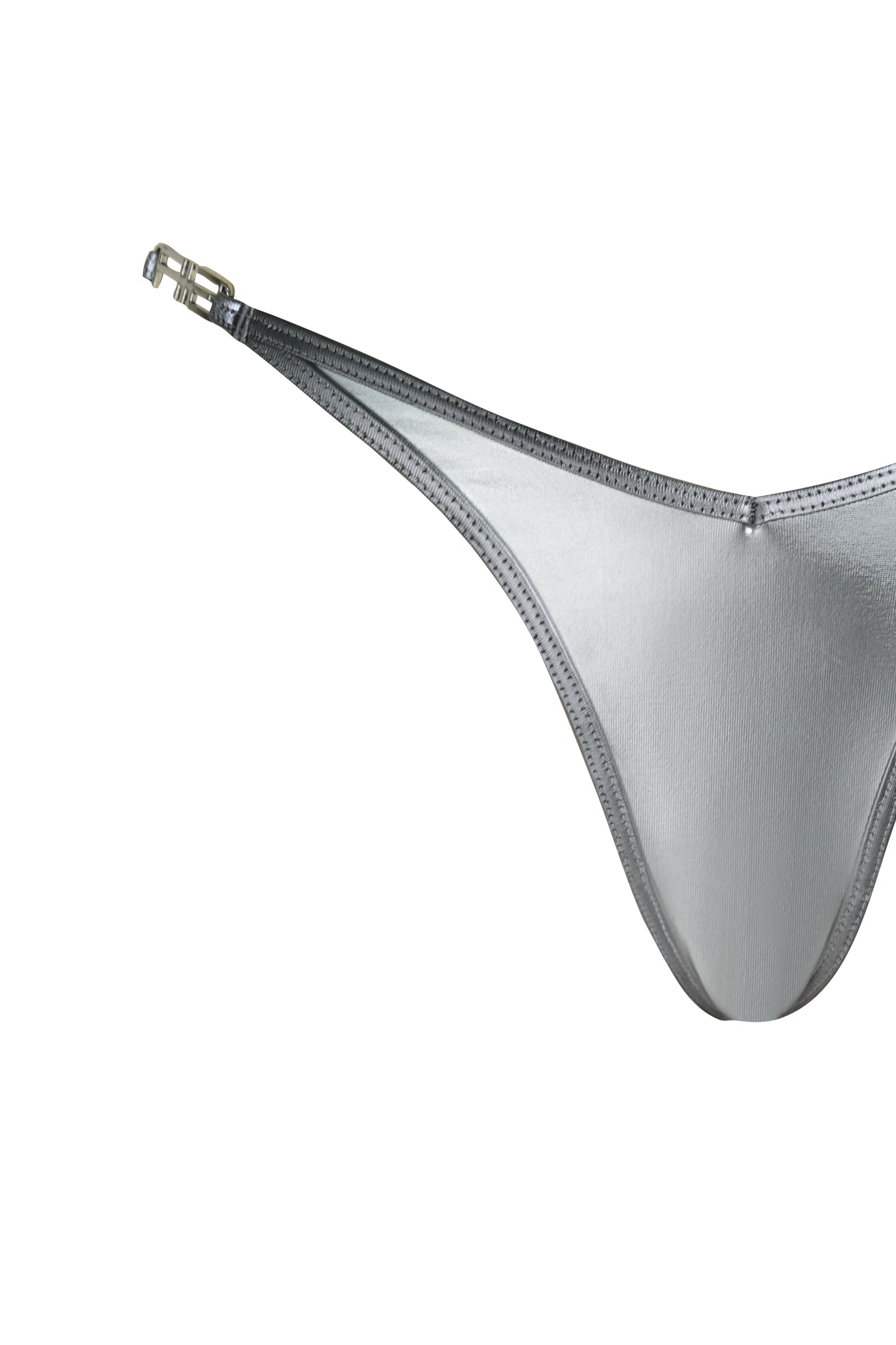 A close-up of the I.AM.GIA LIOR BIKINI BOTTOM - SILVER, featuring a metallic finish, thin waistband, and buckle detail on the left side, isolated on a white background.