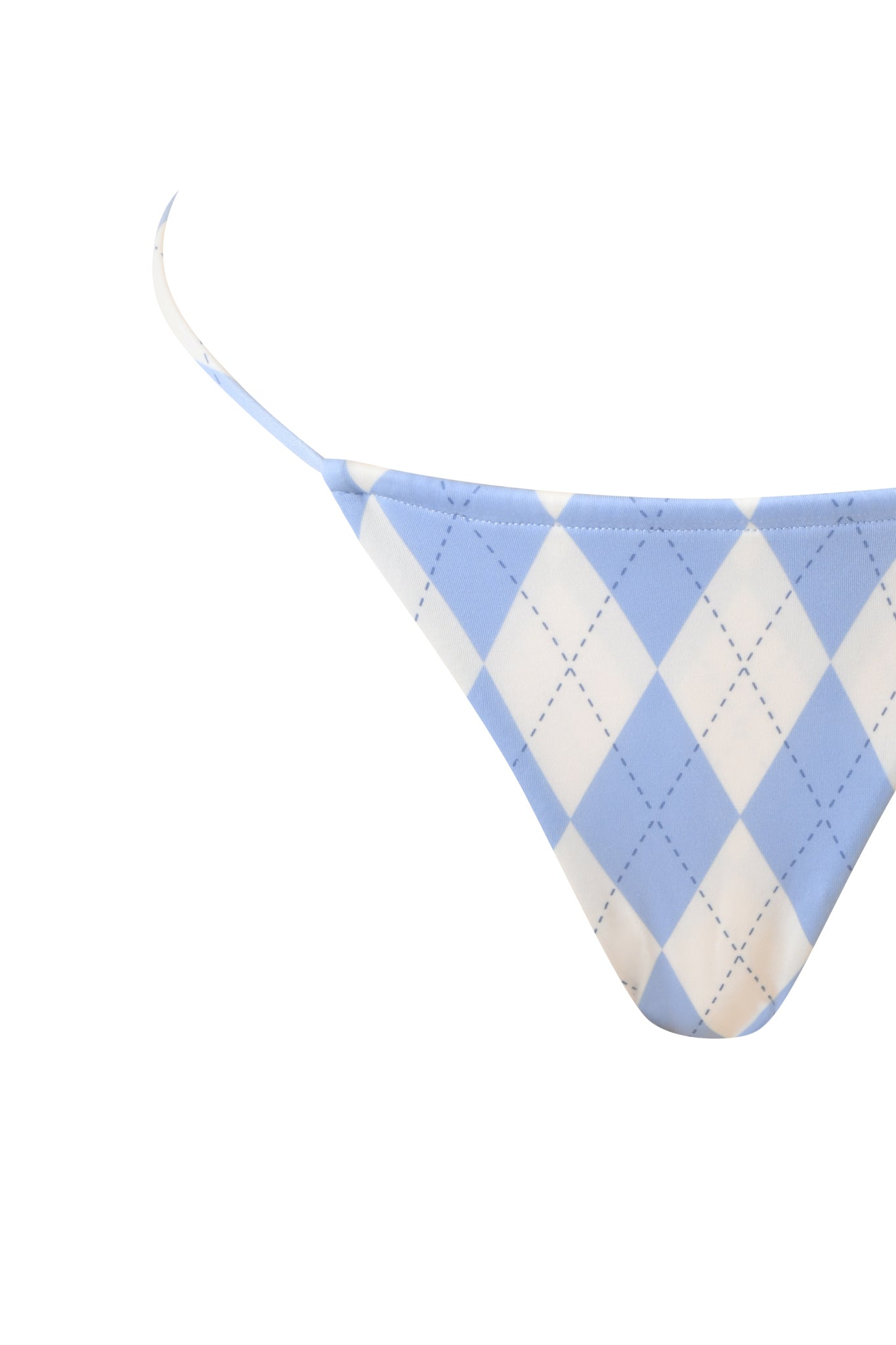 The BRITT BIKINI BOTTOM in blue argyle by I.AM.GIA features thin side straps and a cheeky cut, shown against a white background.