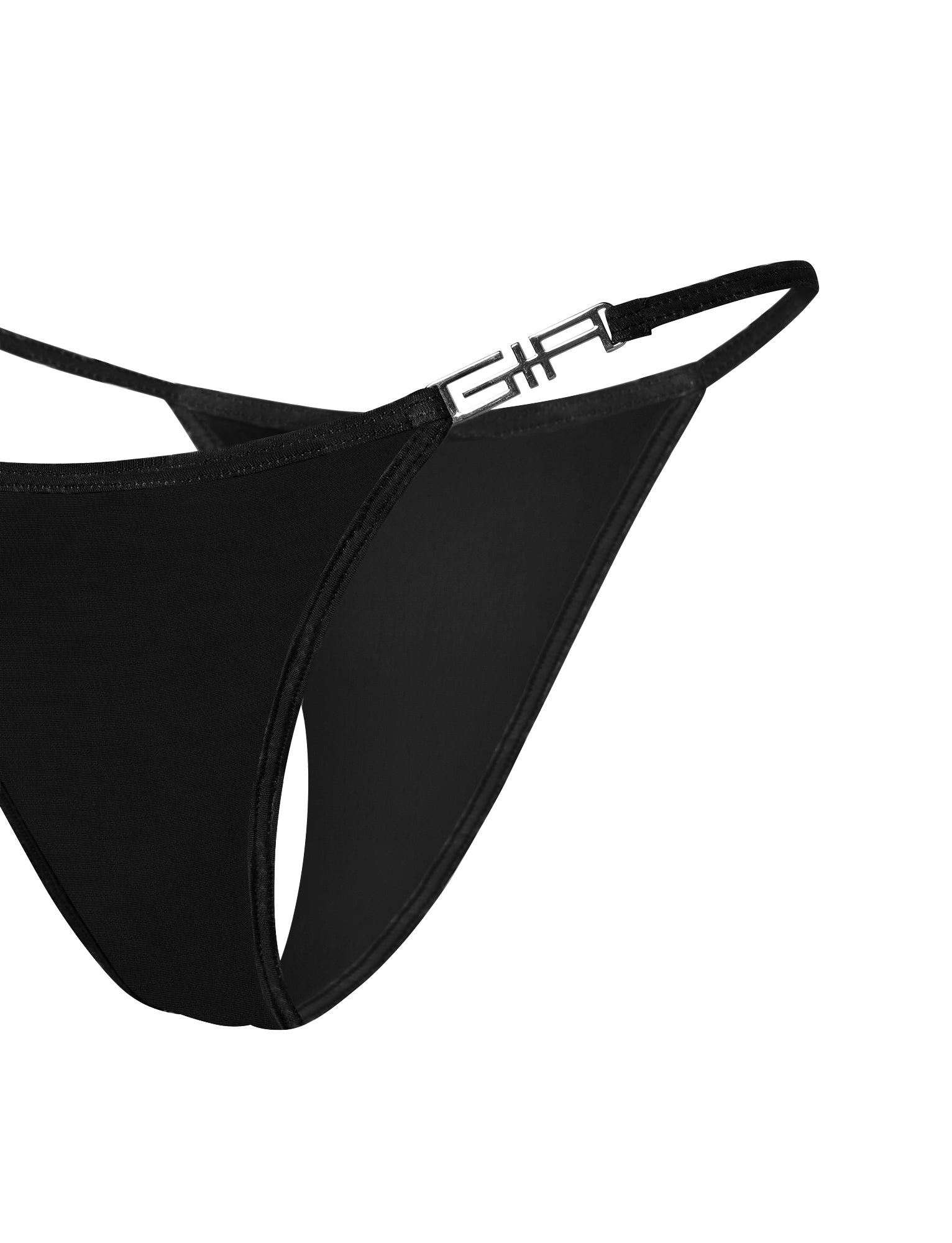 Close-up image of the I.AM.GIA AVA G-STRING BIKINI BOTTOM in solid black, featuring a thin side strap with a metallic G-shaped embellishment. The smooth, minimalistic fabric emphasizes simplicity and elegance in design.