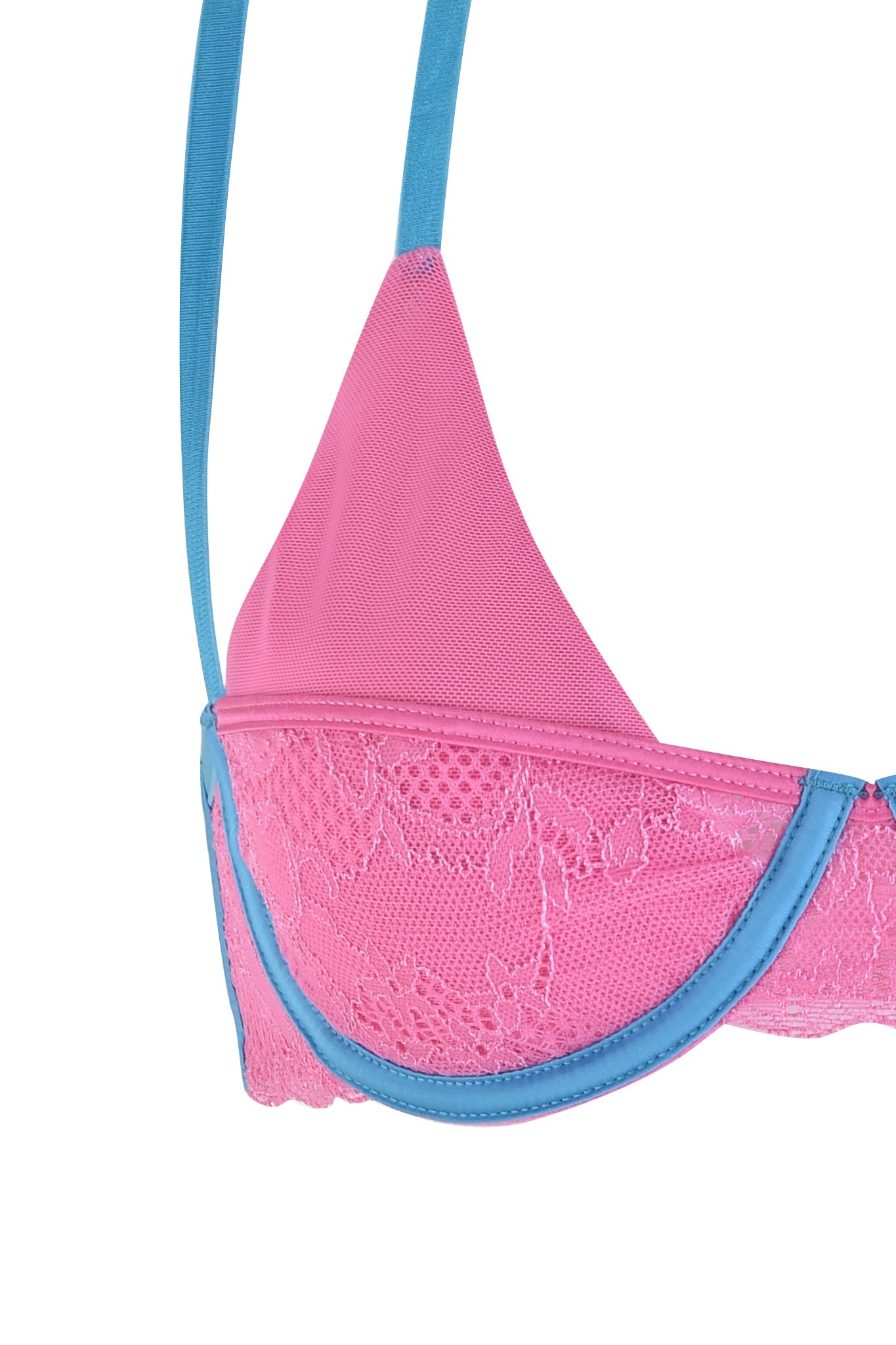 A close-up of the CHANTEL SET - PINK : BABY BLUE bralette by I.AM.GIA shows its delicate floral lace pattern and striking blue elastic with adjustable straps. The alluring design features blue trimming along the cup and band, expertly combining mesh and lace for an enchanting look.