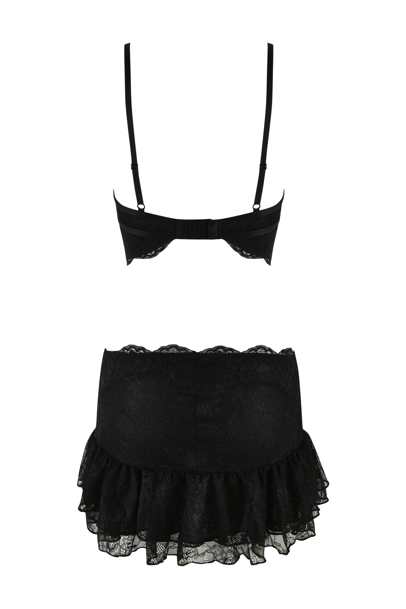 The SCARLETTE DRESS - BLACK by I.AM.GIA is a black lace lingerie set that includes a bra with adjustable straps and a back hook closure, along with a matching skirt featuring a ruffled hem. The fabric is adorned with delicate floral pinstripe lace trims, offering a feminine and elegant look.