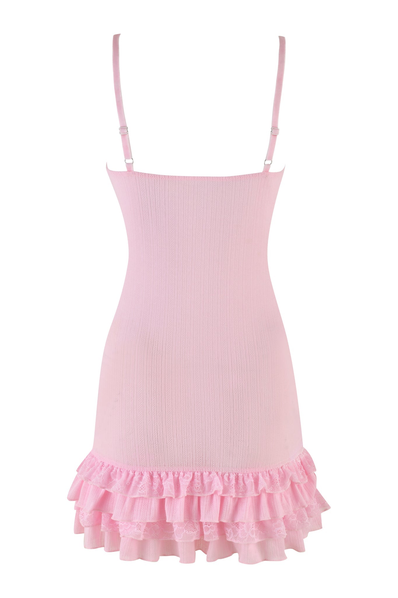 The sleeveless Mirabelle Dress in pink by I.AM.GIA features adjustable spaghetti straps and a ribbed texture on the upper part. Its design is completed with three layers of ruffled fabric at the hem, creating a playful and feminine look.