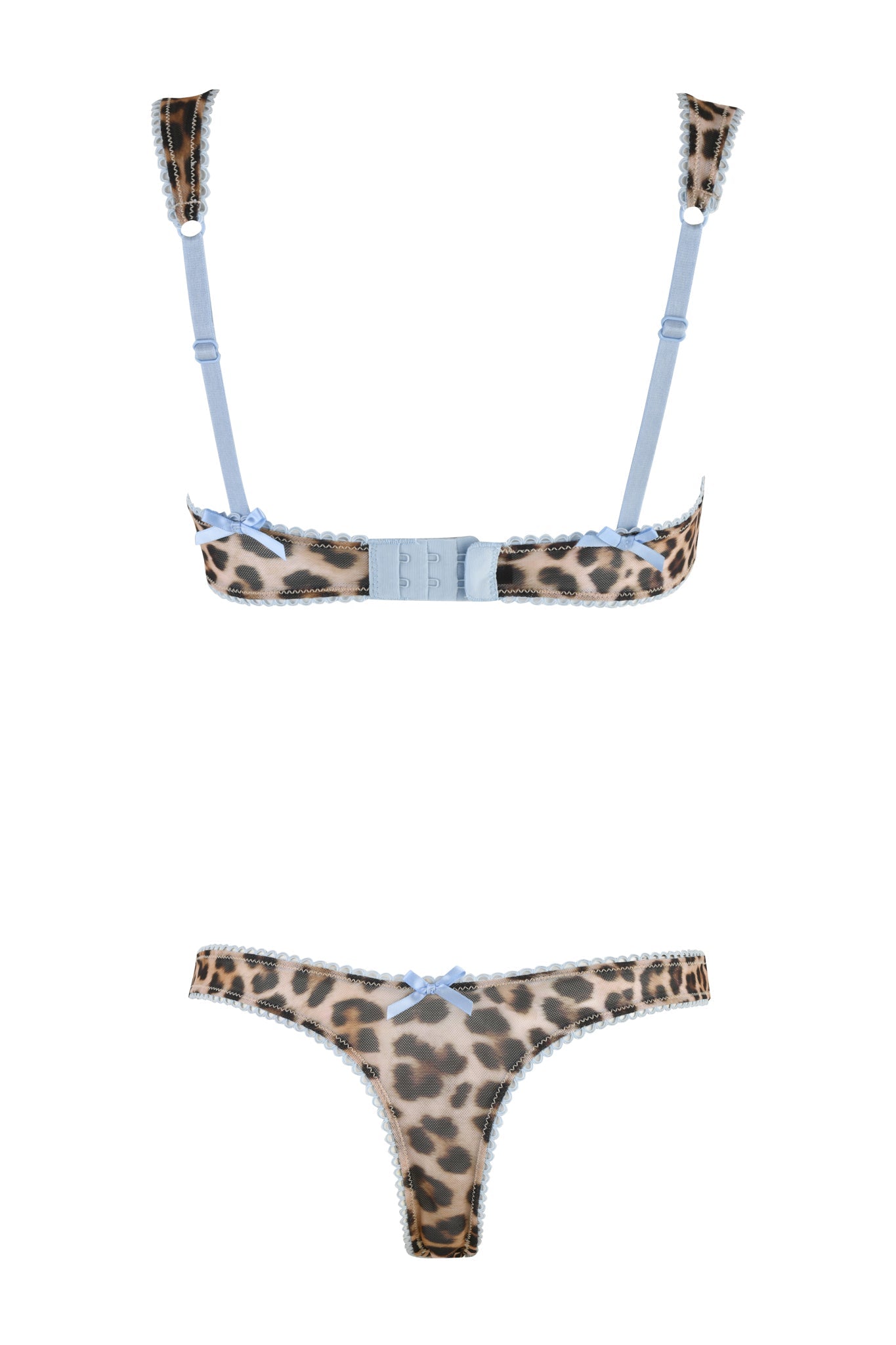 The AMANDA SET - NEUTRAL : LEOPARD by I.AM.GIA is a leopard print lingerie set adorned with light blue lace trim and accents. The bra boasts adjustable straps and a back clasp, while the coordinating thong is embellished with a small blue bow on the front, providing versatile options for a bold yet delicate look.