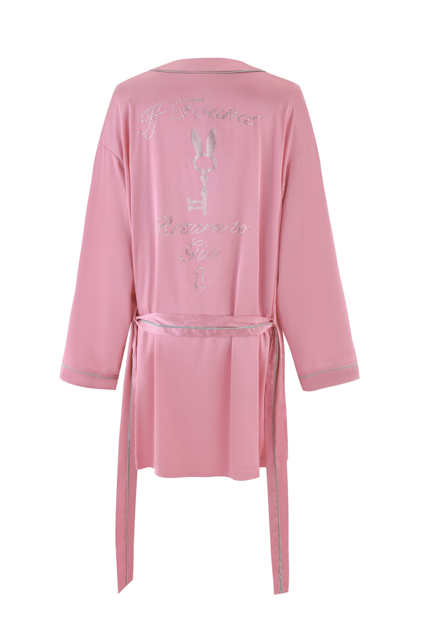 Introducing the MARTINA SLEEP ROBE - PINK by I.AM.GIA: This luxuriously silky satin robe offers a relaxed fit, enhanced with a belt and exquisite silver embroidery on the back. The sophisticated design showcases a charming bunny logo paired with elegant cursive text, effortlessly merging comfort with style.