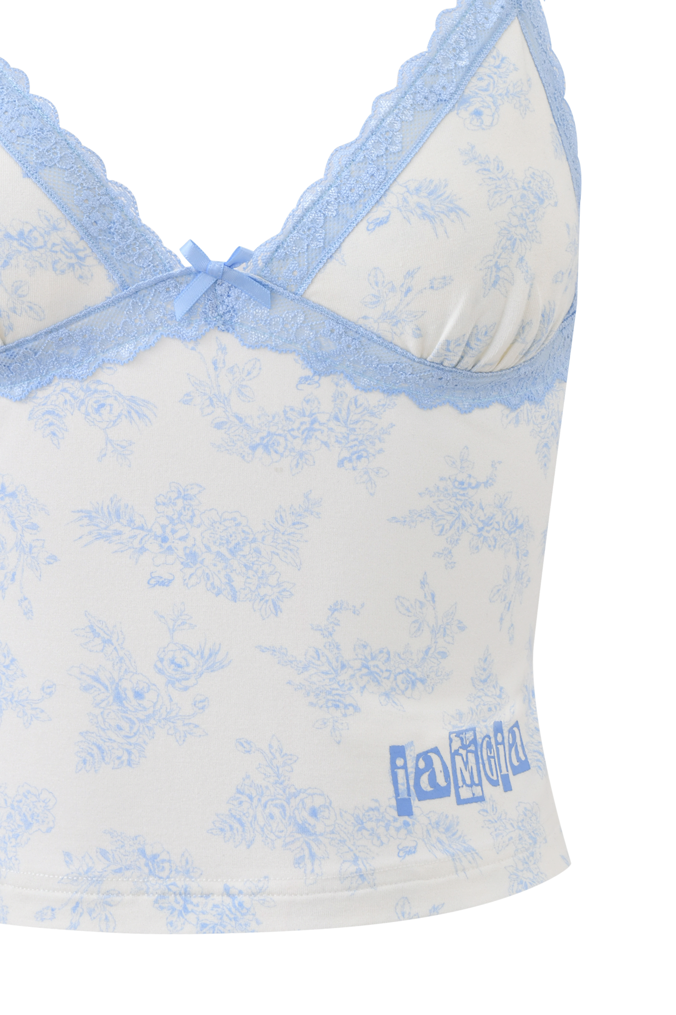 A close-up of the KENDRA TANK - BLUE TOILE by I.AM.GIA, featuring a white camisole with light blue floral print, blue lace trim, a center bow, and "i am gia" printed near the hem.