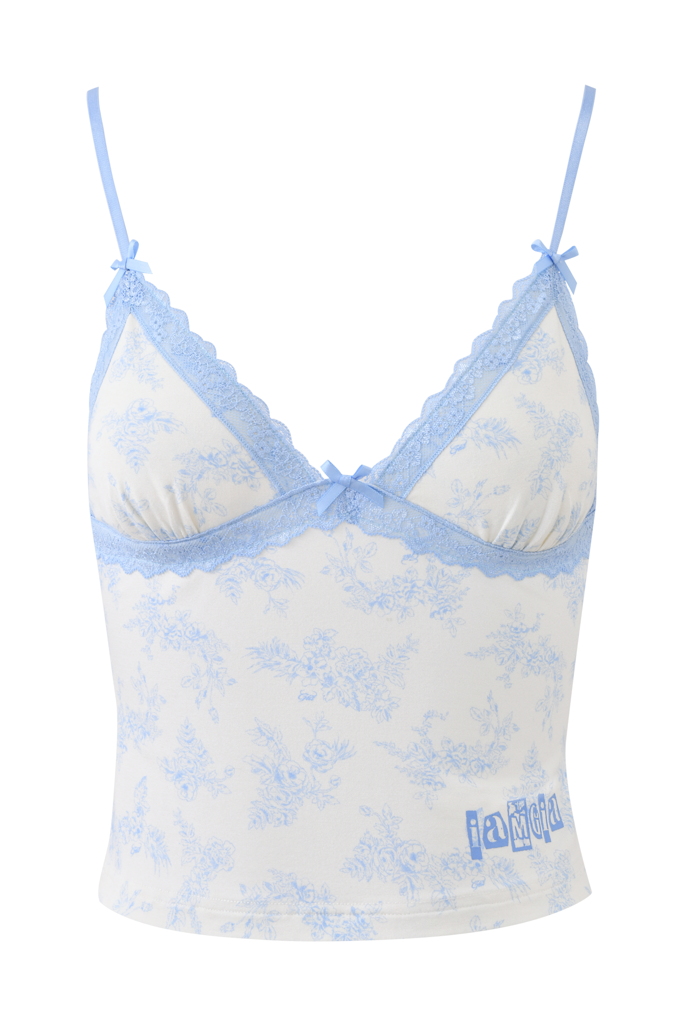 The KENDRA TANK - BLUE TOILE by I.AM.GIA features a white base with a light blue floral print, blue lace trim, thin straps, and small bows. The “iamgia” logo is printed near the hem for a signature touch.