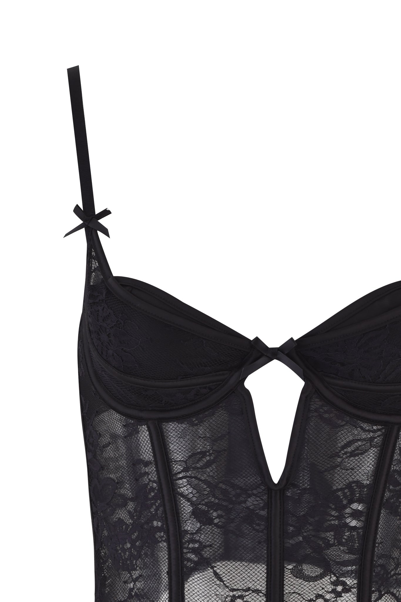 Close-up of the JACQUELINE BUSTIER SET - BLACK by I.AM.GIA, featuring adjustable thin straps, a small bow on the left strap, sheer floral lace fabric, and a front cutout below the bust.