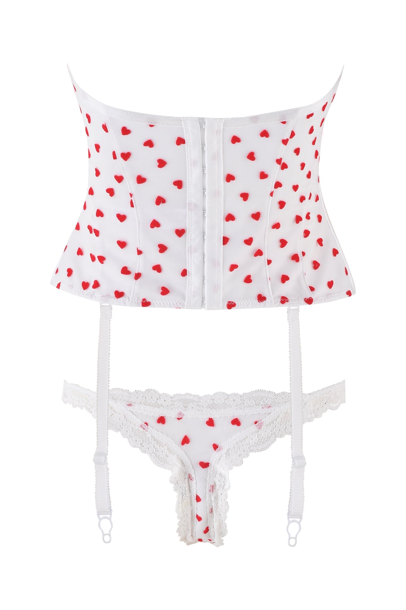 The PAMELA SET - WHITE: HEARTBEAT by I.AM.GIA features a vintage-inspired bustier with heart flocked tulle patterns, removable garter straps, and a matching lacy thong, elegantly displayed on a plain white background.