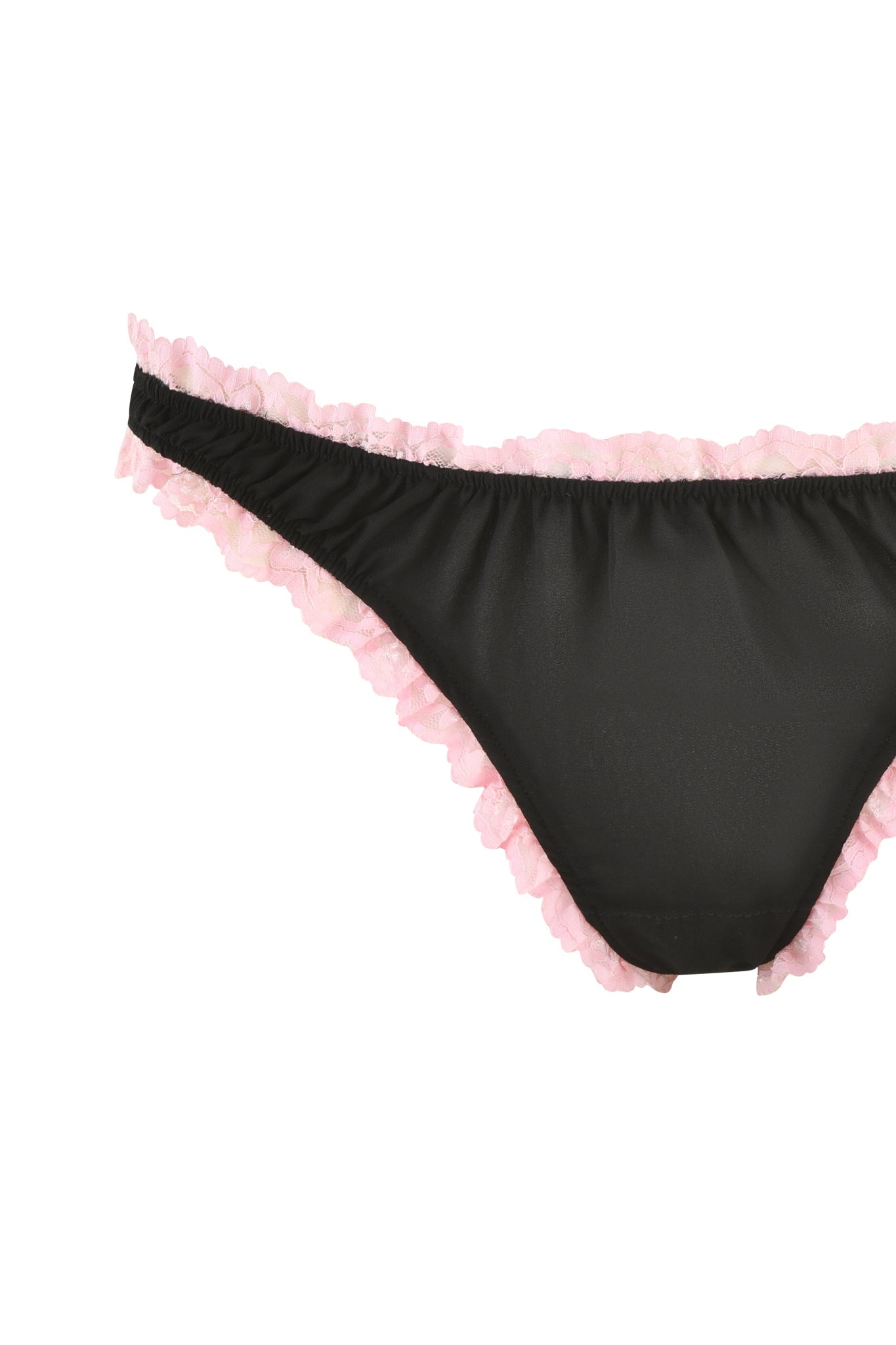 The JUNIPER ROBE THREE-PIECE SET - BLACK by I.AM.GIA features black bikini bottoms with a delicate pink ruffle trim at the waistband and leg openings, elegantly showcased as part of a stylish three-piece ensemble against a white backdrop.