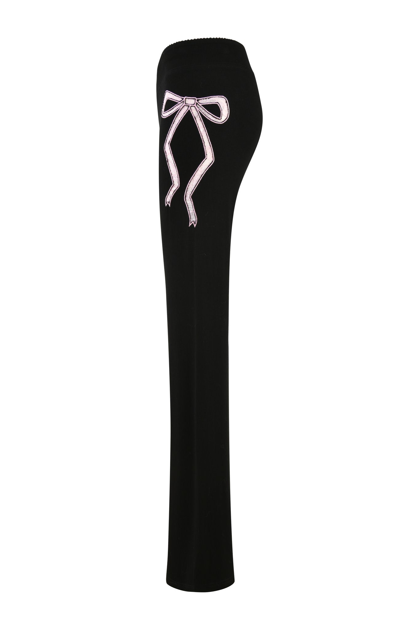 Side view of the ASTRID PANT - BLACK by I.AM.GIA, featuring a pink ribbon detail near the waistband and a flared leg design, displayed on a blank white background.
