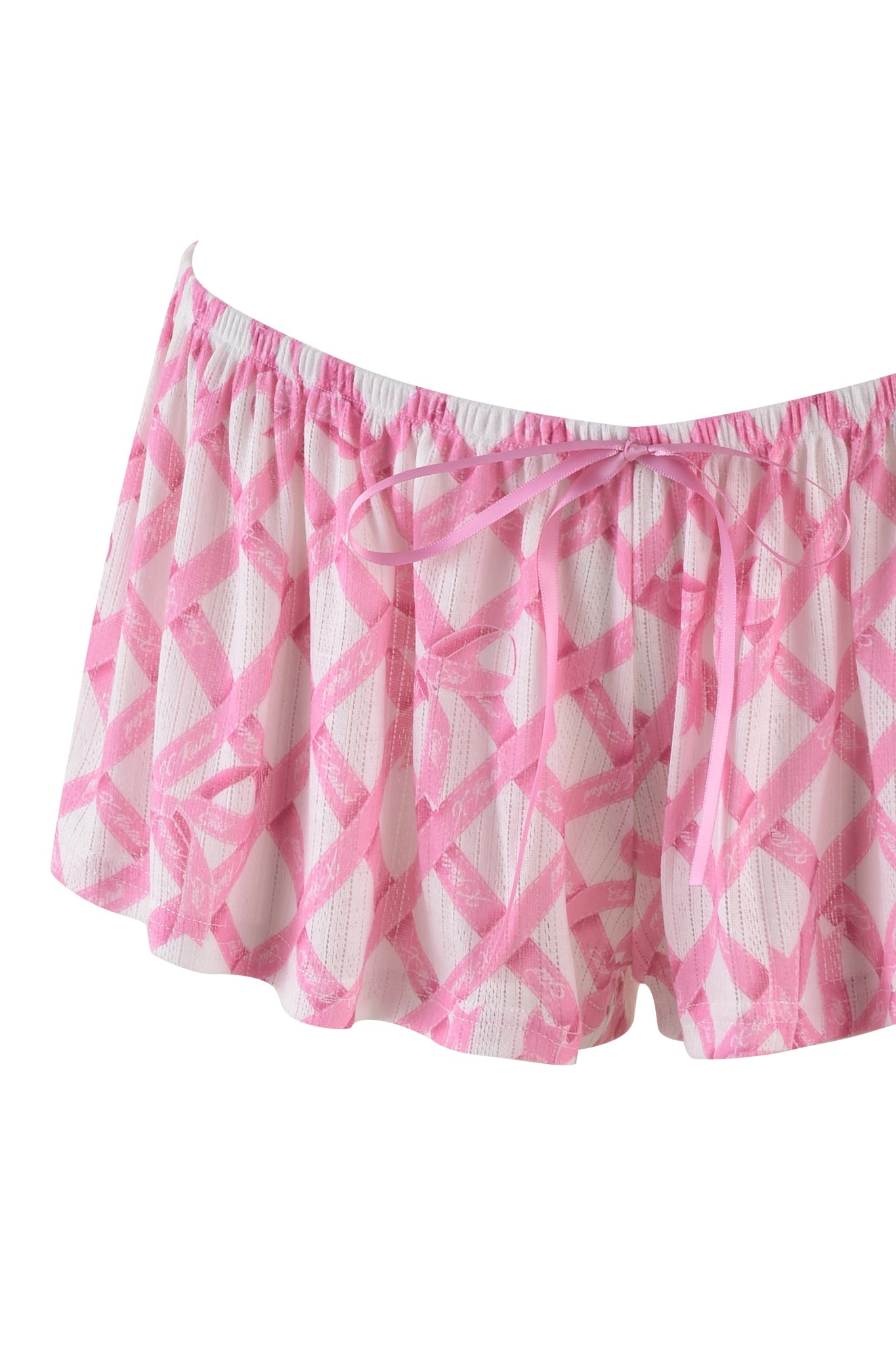 The VIVIENNE SHORT by I.AM.GIA is pink and white with a geometric pattern in pointelle knit fabric, featuring an elastic waistband and a small front bow.