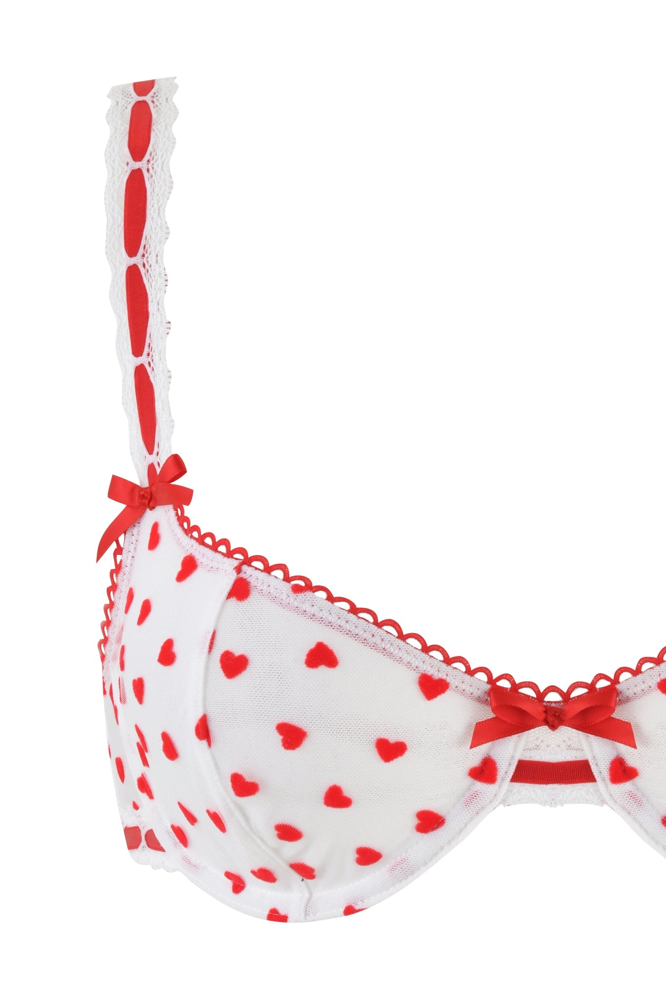 The I.AM.GIA ROMY 2 Piece Set - White: Heartbeat features a vintage-inspired white bra with red heart patterns, lace trim, scalloped lace edge at the top, and decorative lace along straps with two small red bows for added elegance.