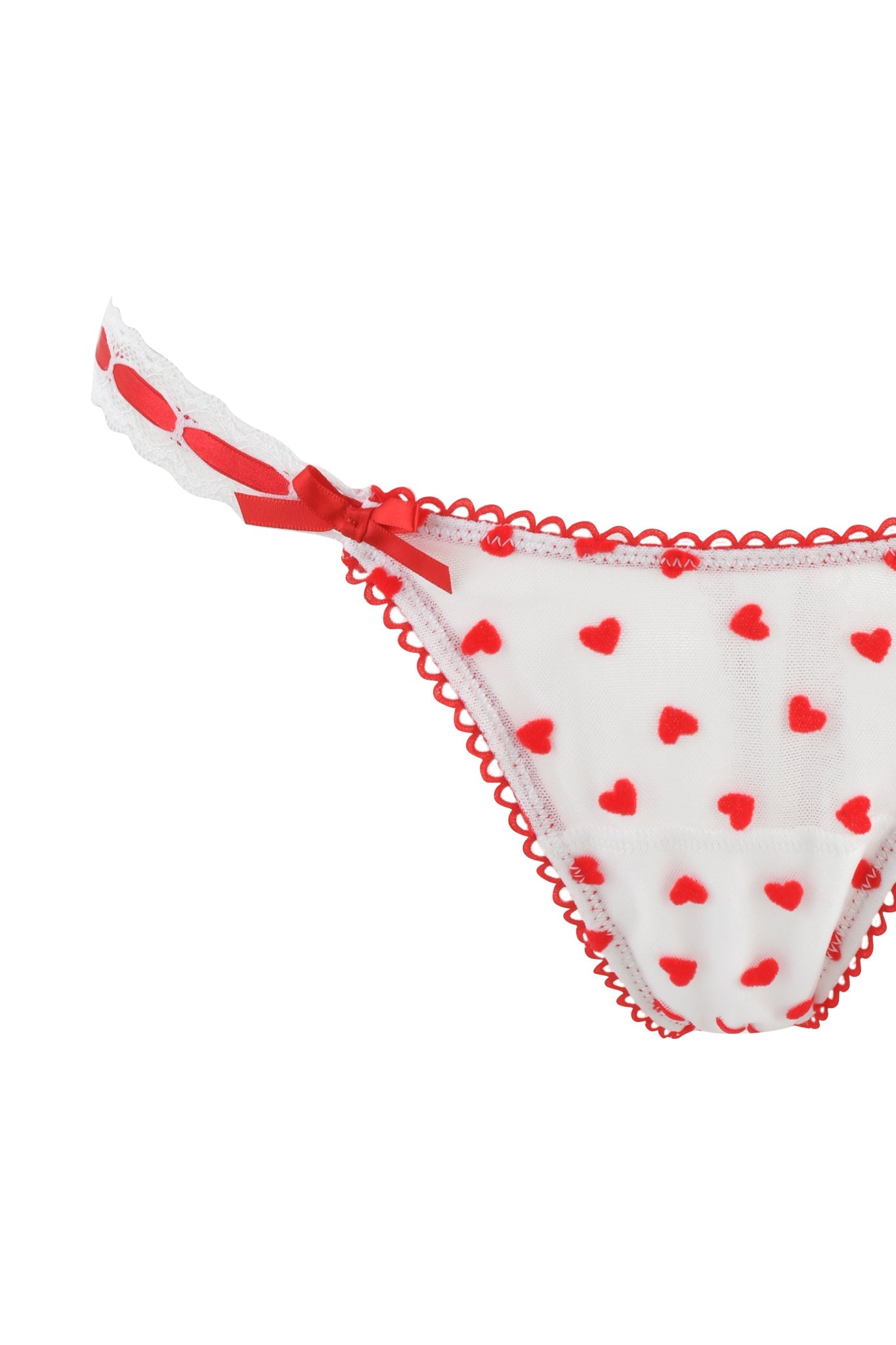 The ROMY 2 PIECE SET - WHITE : HEARTBEAT by I.AM.GIA offers vintage-inspired white lace underwear with red heart patterns and scalloped edges, completed with a small red bow on the side strap for timeless charm and elegance.