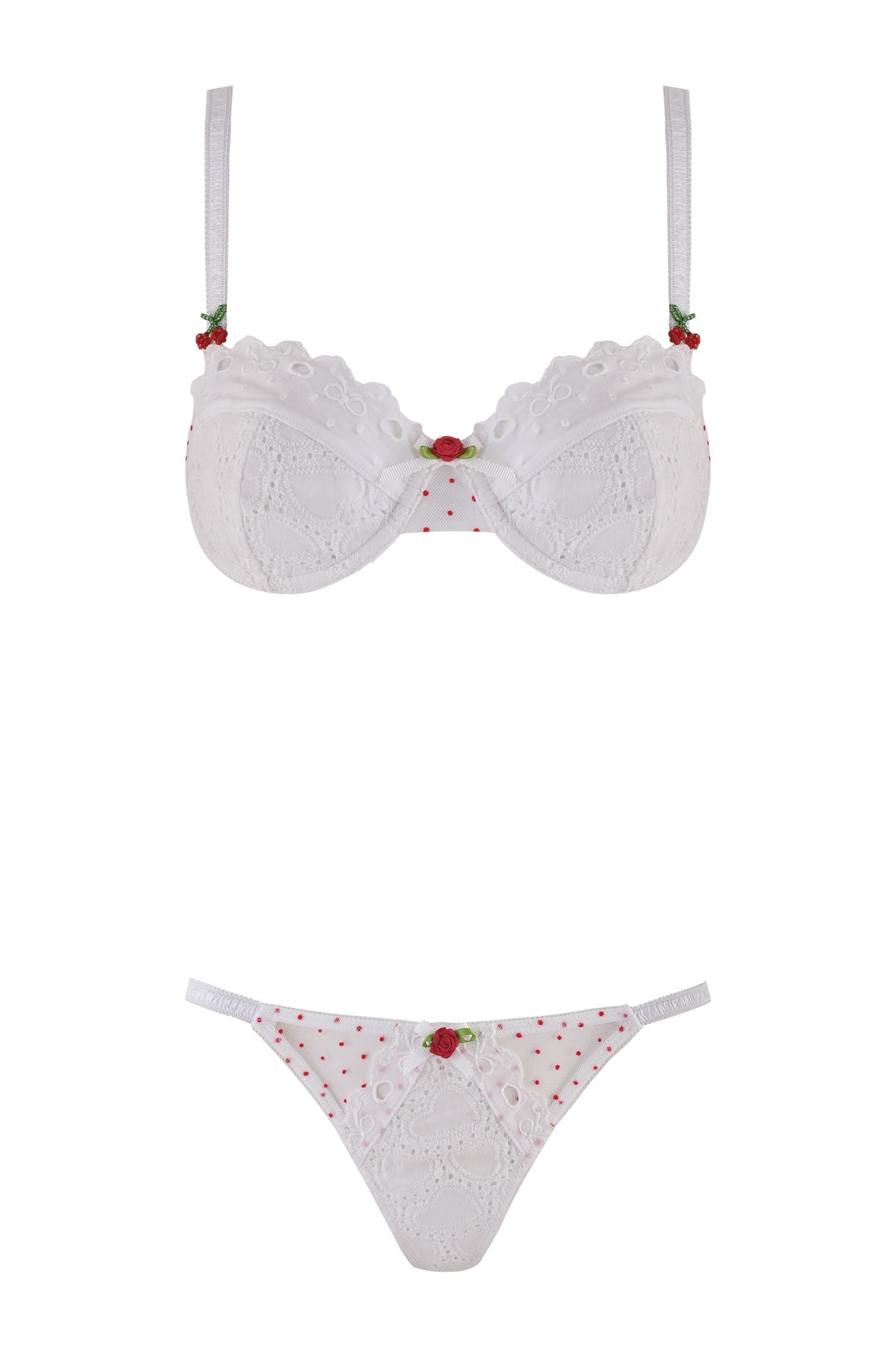 The CHRISSY SET - WHITE by I.AM.GIA is a white lingerie set with red polka dots, lace details, and small red rose accents. It offers adjustable shoulder straps for the perfect fit and is showcased on a white background.