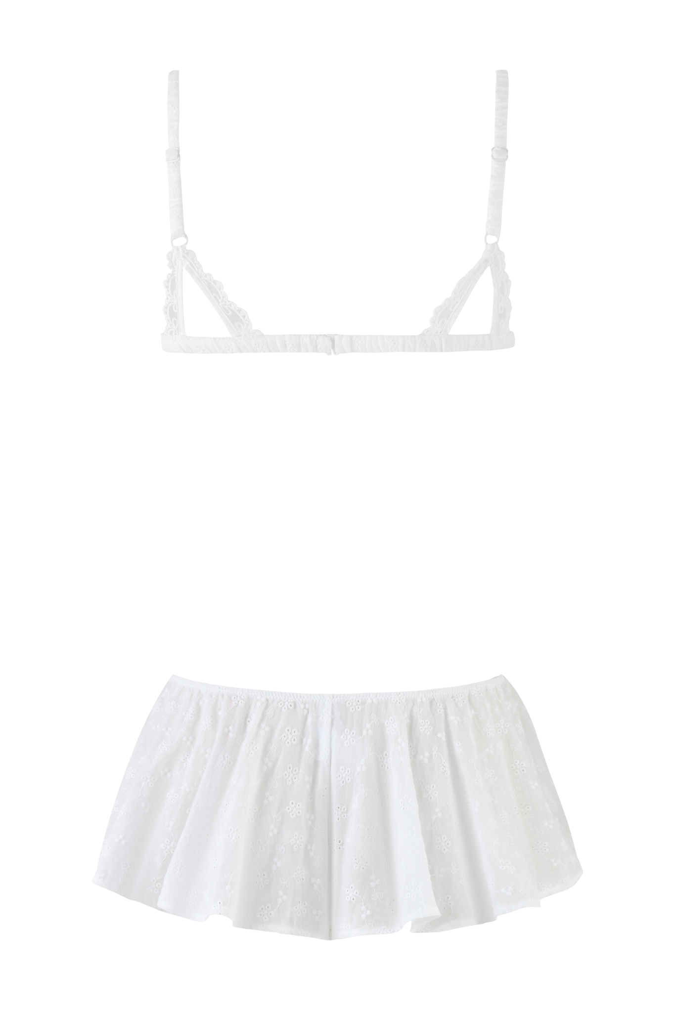 The JUNIE SHORT SET - WHITE by I.AM.GIA features a white sleeveless top with spaghetti straps, a ruffled hem, and eyelet embroidery, perfect for pairing with frilly shorts for a playful summer look.