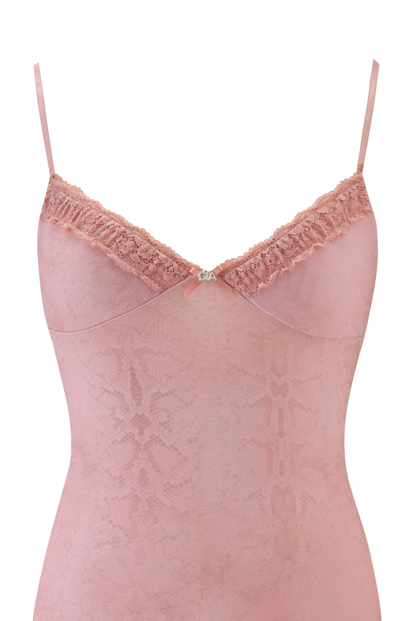 The KISA SLIP DRESS - PEACH SERPENTINE by I.AM.GIA features a pink serpentine print, lace trim, thin straps, a bow at the neckline, and a subtle textured fabric inspired by the brand's chic mini slip dress style.