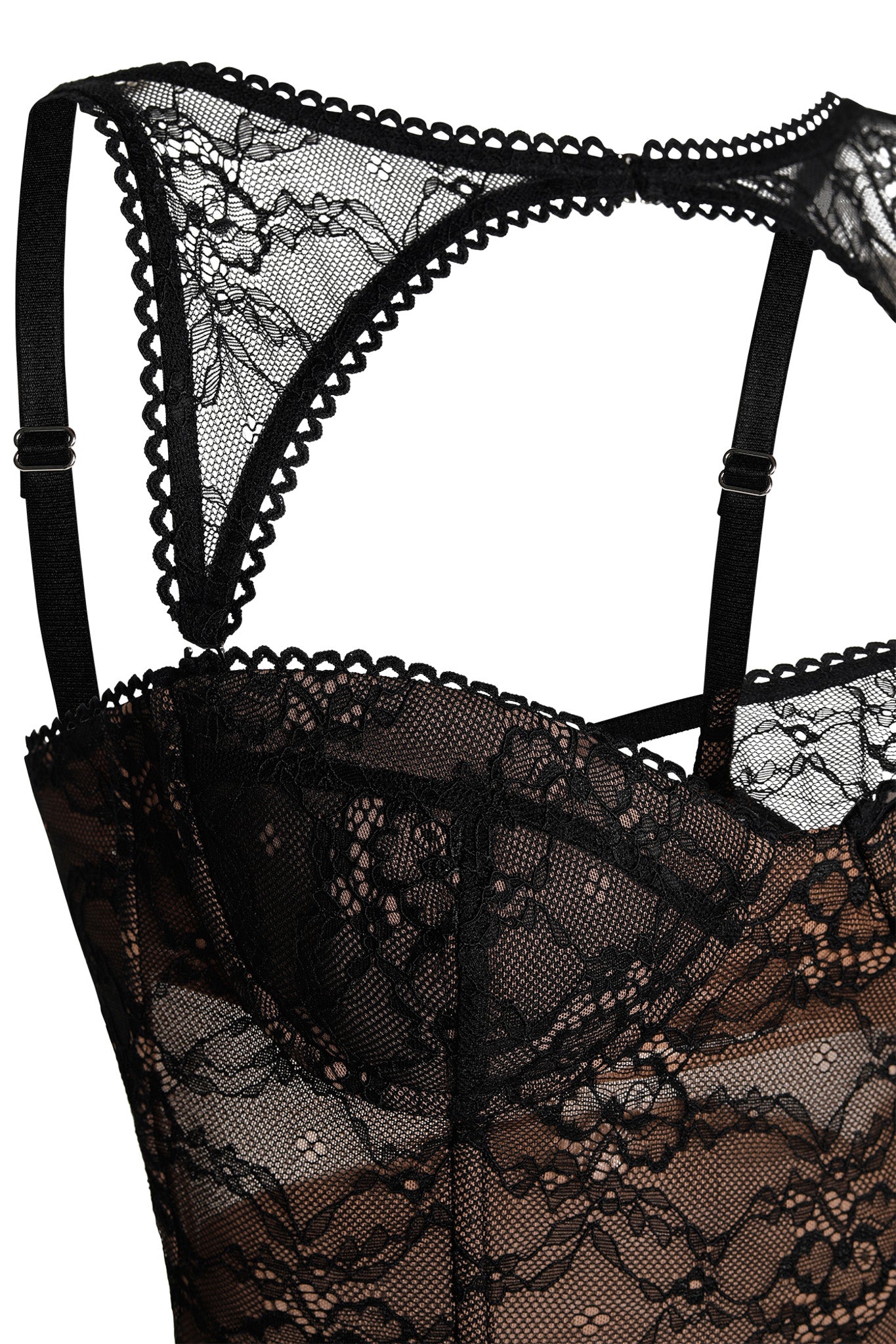 Close-up of the KIANA BUSTIER - BLACK from I.AM.GIA, showcasing intricate floral lace patterns and scalloped edges. The bustier features adjustable shoulder straps and is displayed against a plain background.