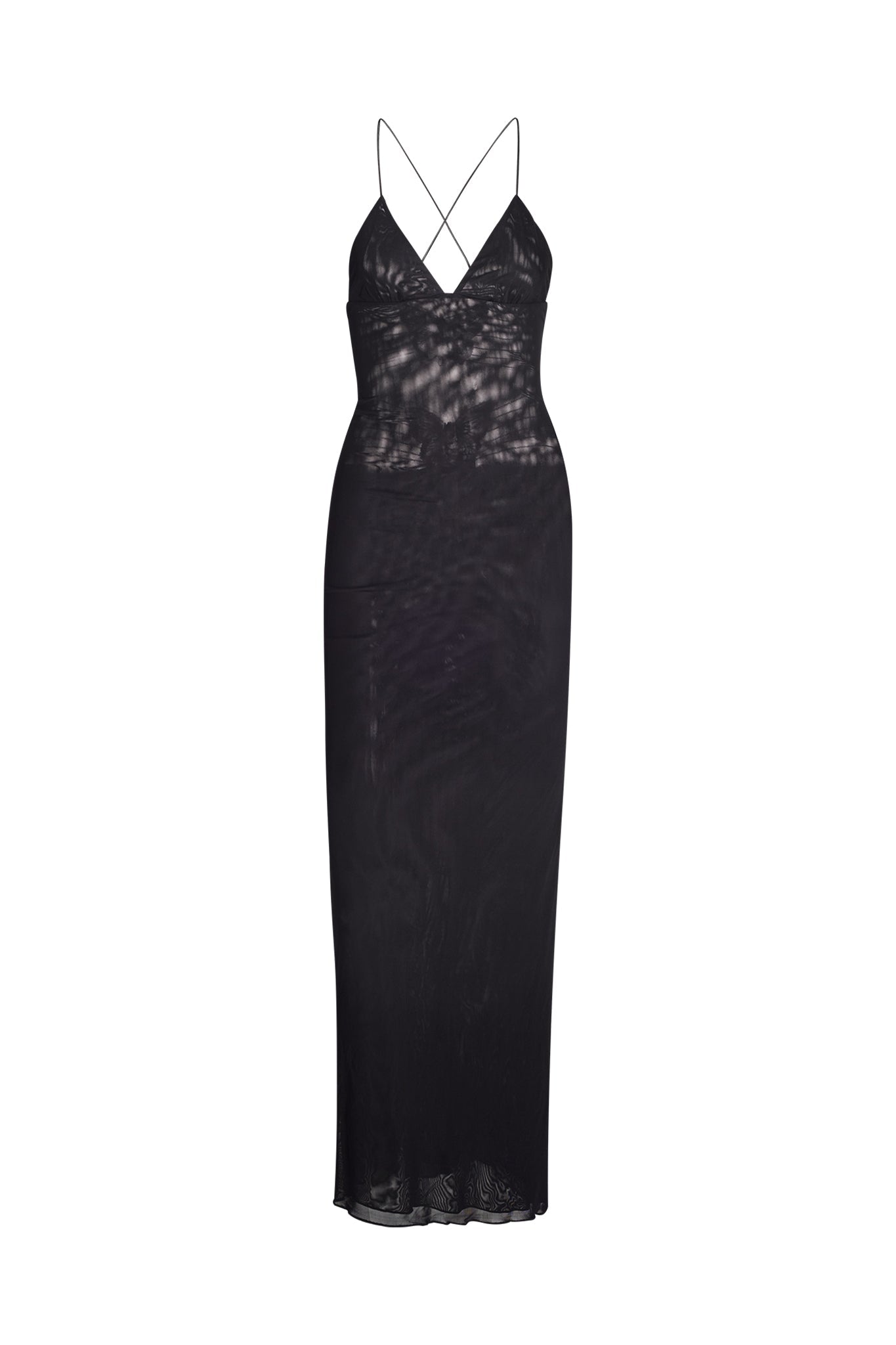 The ELLERY DRESS - BLACK by I.AM.GIA is a long, sheer dress featuring thin spaghetti straps and a deep V-neckline. It showcases a crisscross strap design on the back and has a slightly flared hem. The translucent fabric provides a subtle, see-through effect.