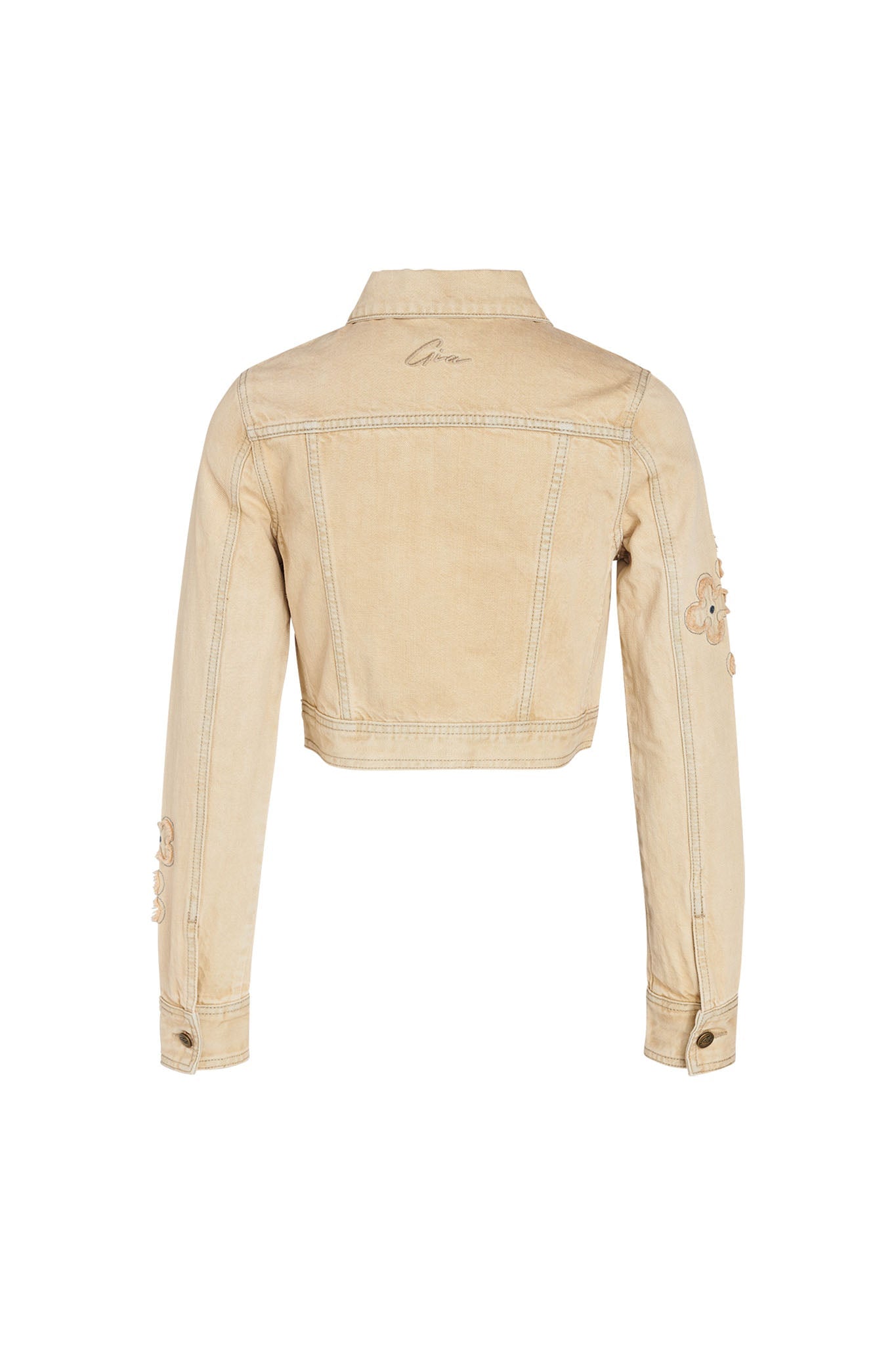 Back view of the FAUNA JACKET - BEIGE : TAN DENIM by I.AM.GIA, showcasing embroidery on the sleeves and back. This light beige jacket features a collared neck, long sleeves with buttoned cuffs, and decorative stitching enhancing its structure.